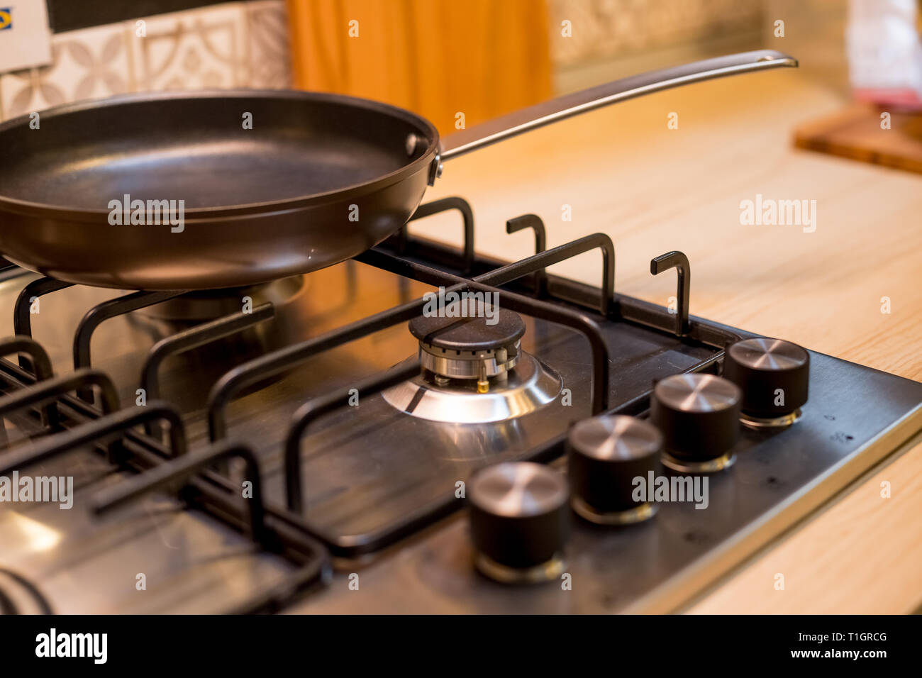 The new frying pan on Brand new gas stove panels.Classic four burner