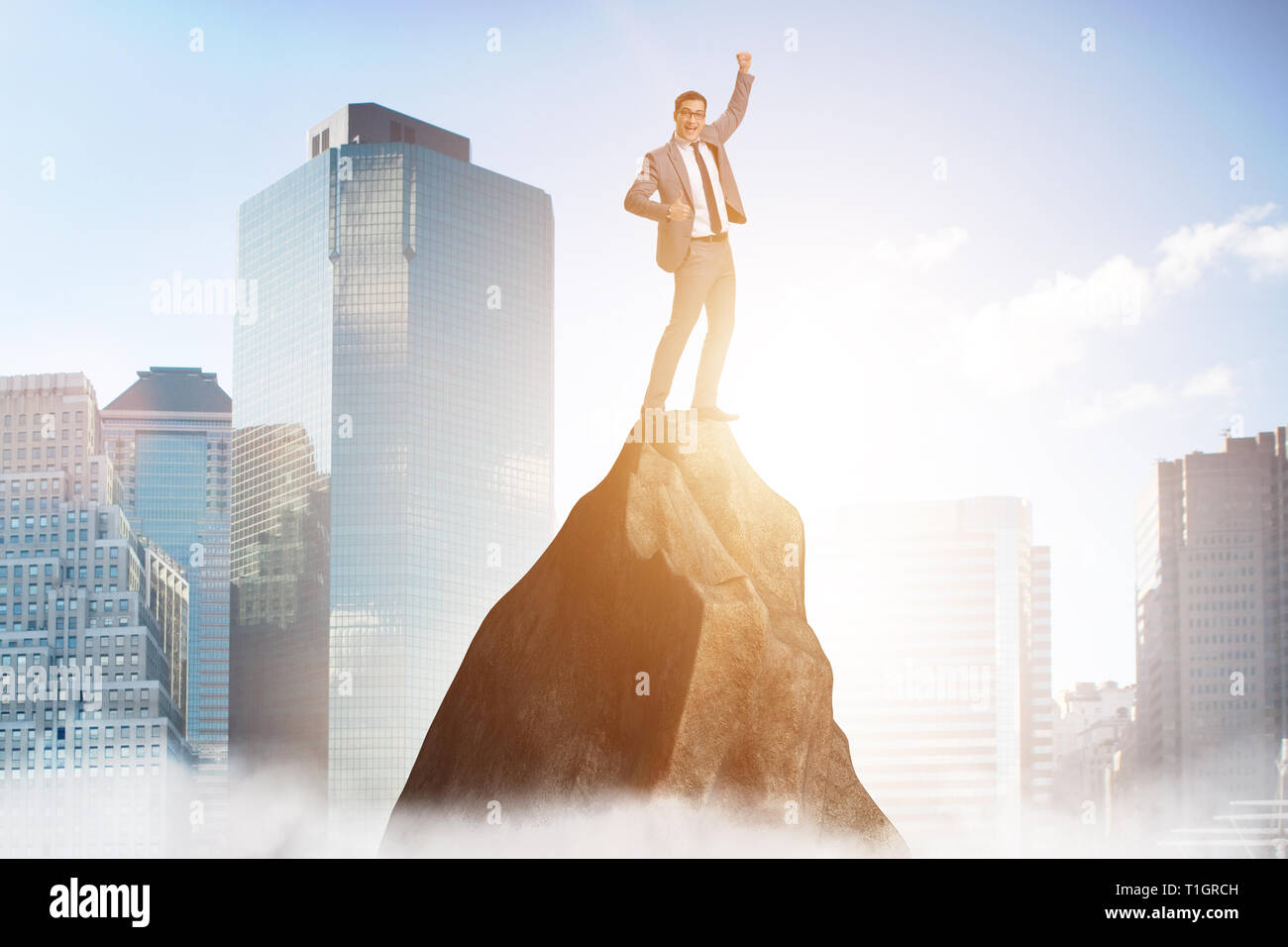 Businessman at the top of mountain Stock Photo - Alamy