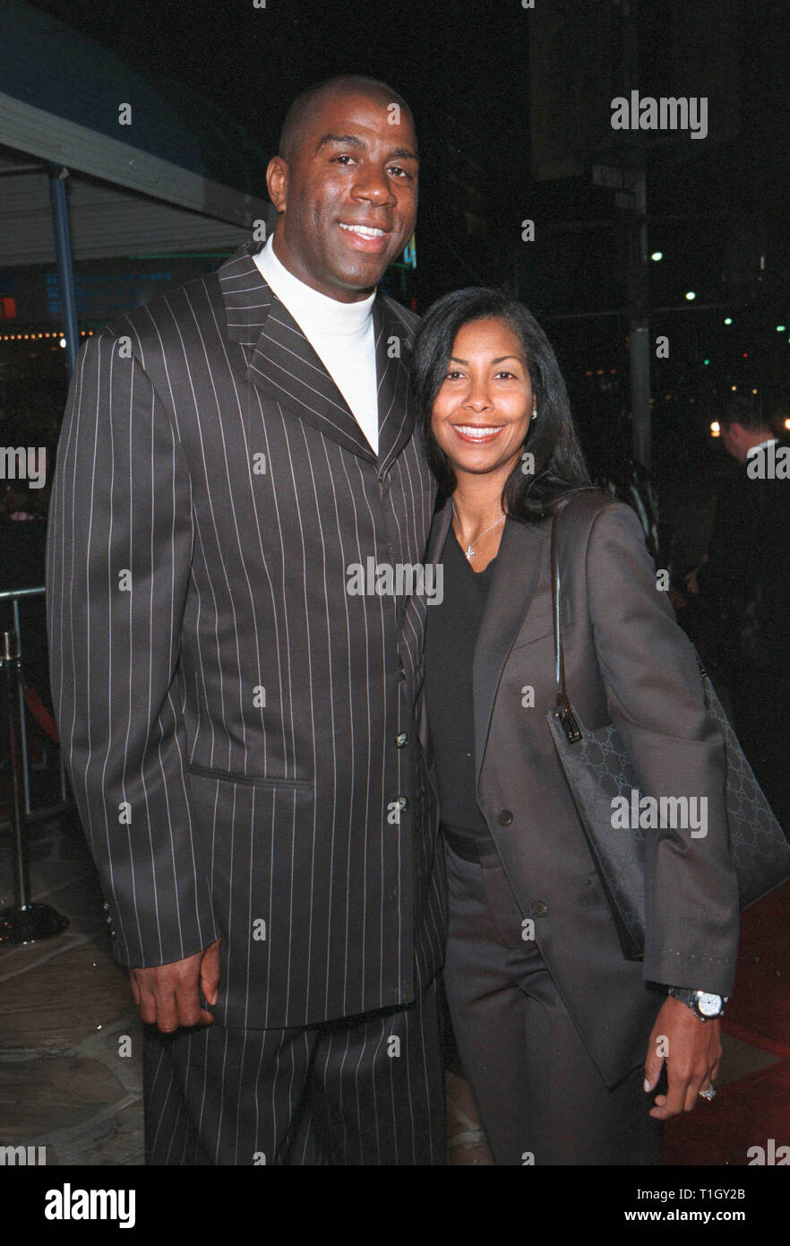 LOS ANGELES, CA - April 14, 1999: Former basketball star EARVIN 'MAGIC' JOHNSON & wife COOKIE JOHNSON at the world premiere in Los Angeles of 'Life' which stars Eddie Murphy & Martin Lawrence. © Paul Smith / Featureflash Stock Photo