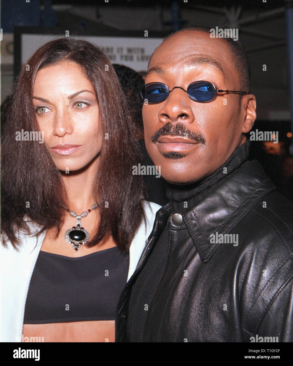 LOS ANGELES, CA - April 13, 1999: Actor EDDIE MURPHY & wife Nicole Mitchell Murphy at the world premiere in Los Angeles of his new movie 'Life' in which he stars with Martin Lawrence. © Paul Smith / Featureflash Stock Photo