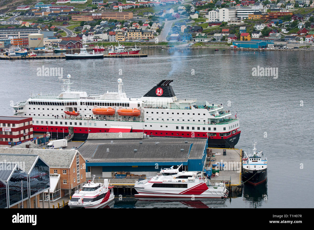 Hammerfest harbour with Hurtigruten cruise ship Kong Harald, Hammerfest, County Finnmark, Norway Stock Photo