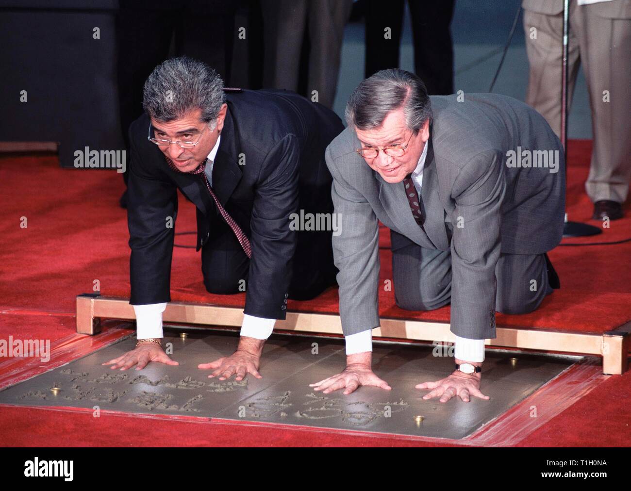 LOS ANGELES, CA. September 30, 1999:   Warner Bros. chairmen & co-CEOs Robert A. Daly (right) & Terry Semel at Mann's Chinese Theatre in Hollywood where they had their hand & footprints set in cement. © Paul Smith / Featureflash Stock Photo
