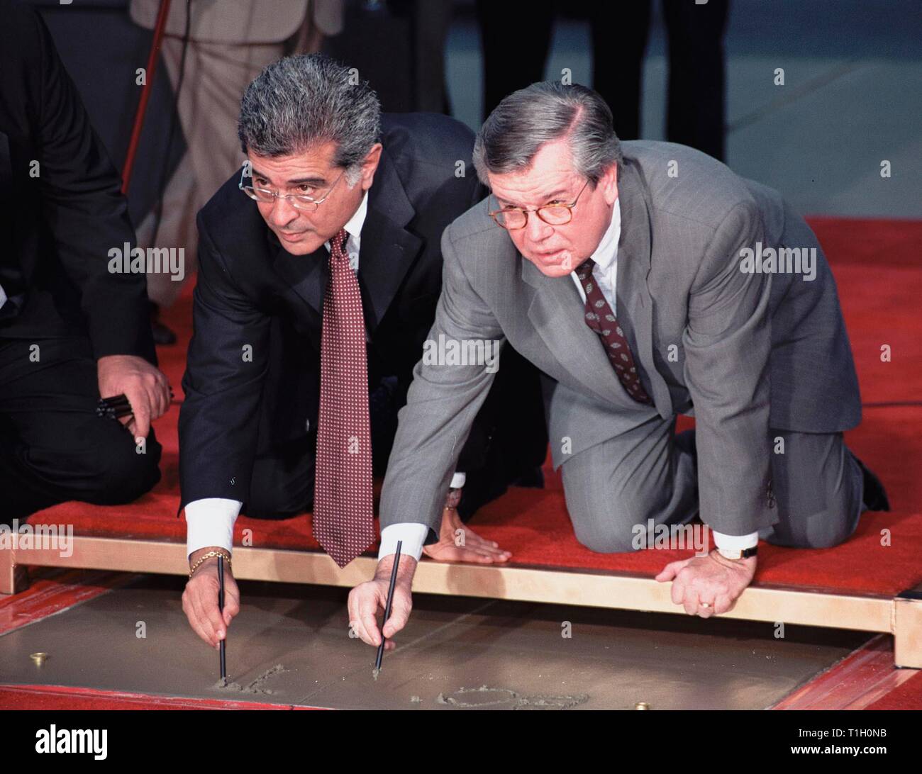 LOS ANGELES, CA. September 30, 1999:   Warner Bros. chairmen & co-CEOs Robert A. Daly (right) & Terry Semel at Mann's Chinese Theatre in Hollywood where they had their hand & footprints set in cement. © Paul Smith / Featureflash Stock Photo