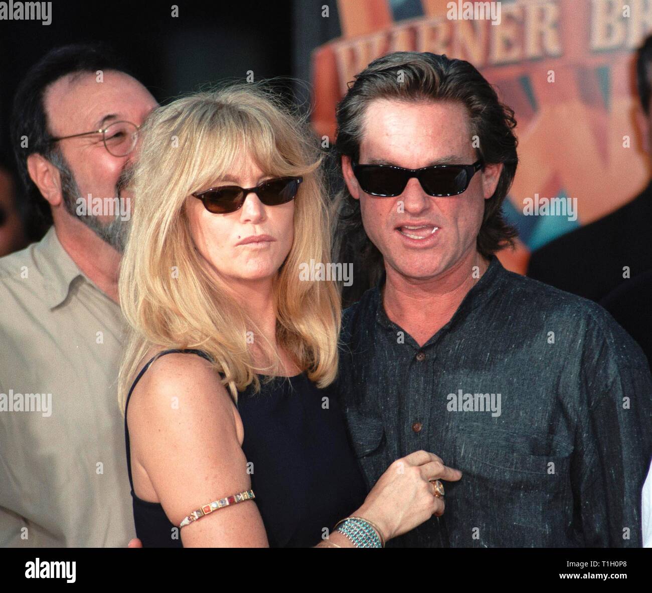 LOS ANGELES, CA. September 30, 1999:   Actress Goldie Hawn & Actor Partner Kurt Russell at Mann's Chinese Theatre in Hollywood where Warner Bros. chairmen & co-CEOs ROBERT A. DALY & TERRY SEMEL had their hand & footprints set in cement. © Paul Smith / Featureflash Stock Photo