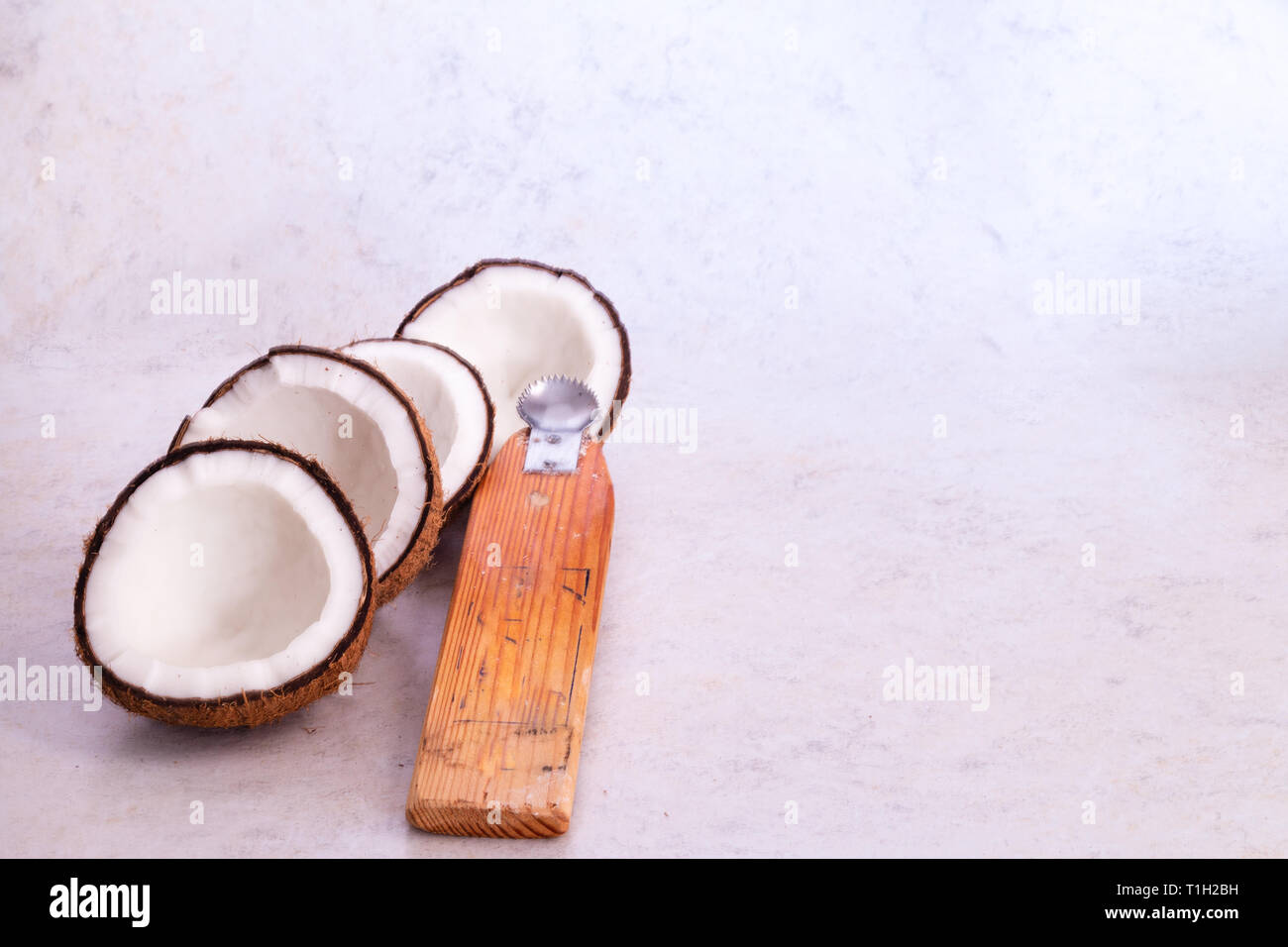 Dry coconut with with textured background. Stock Photo