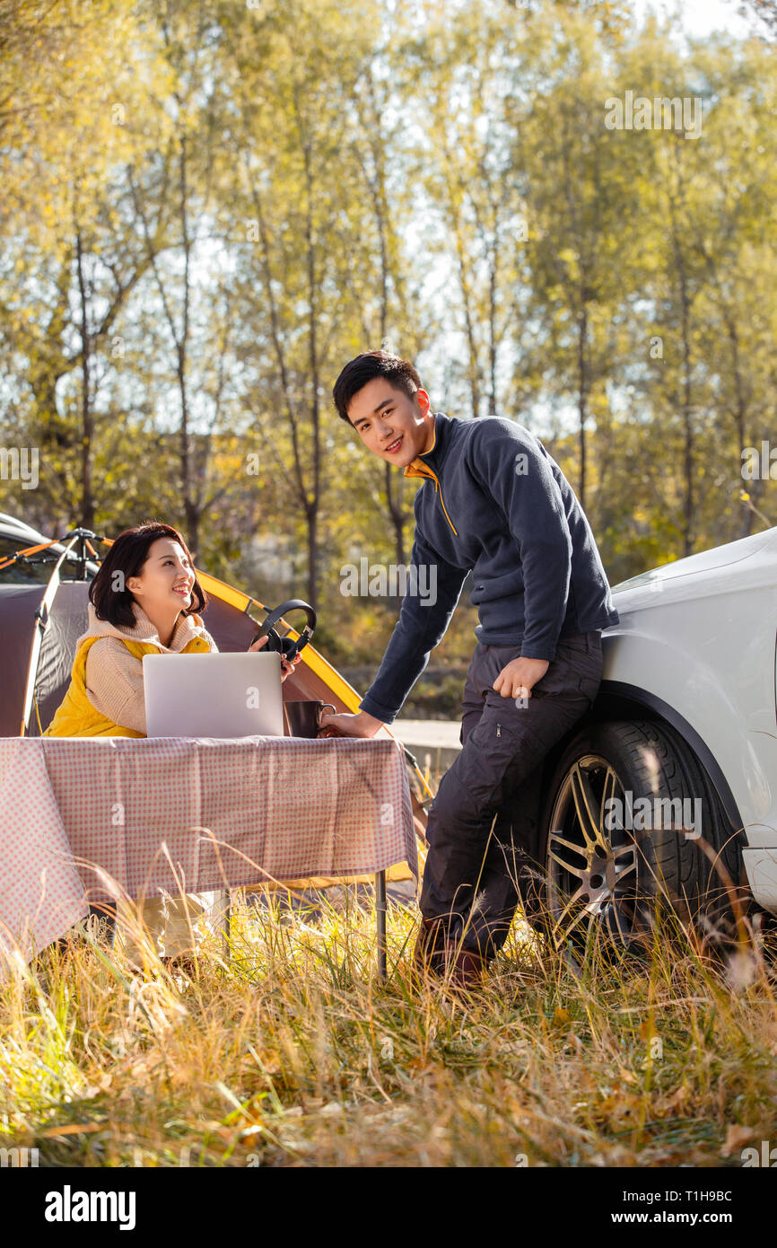 Young men women camping hi-res stock photography and images - Alamy