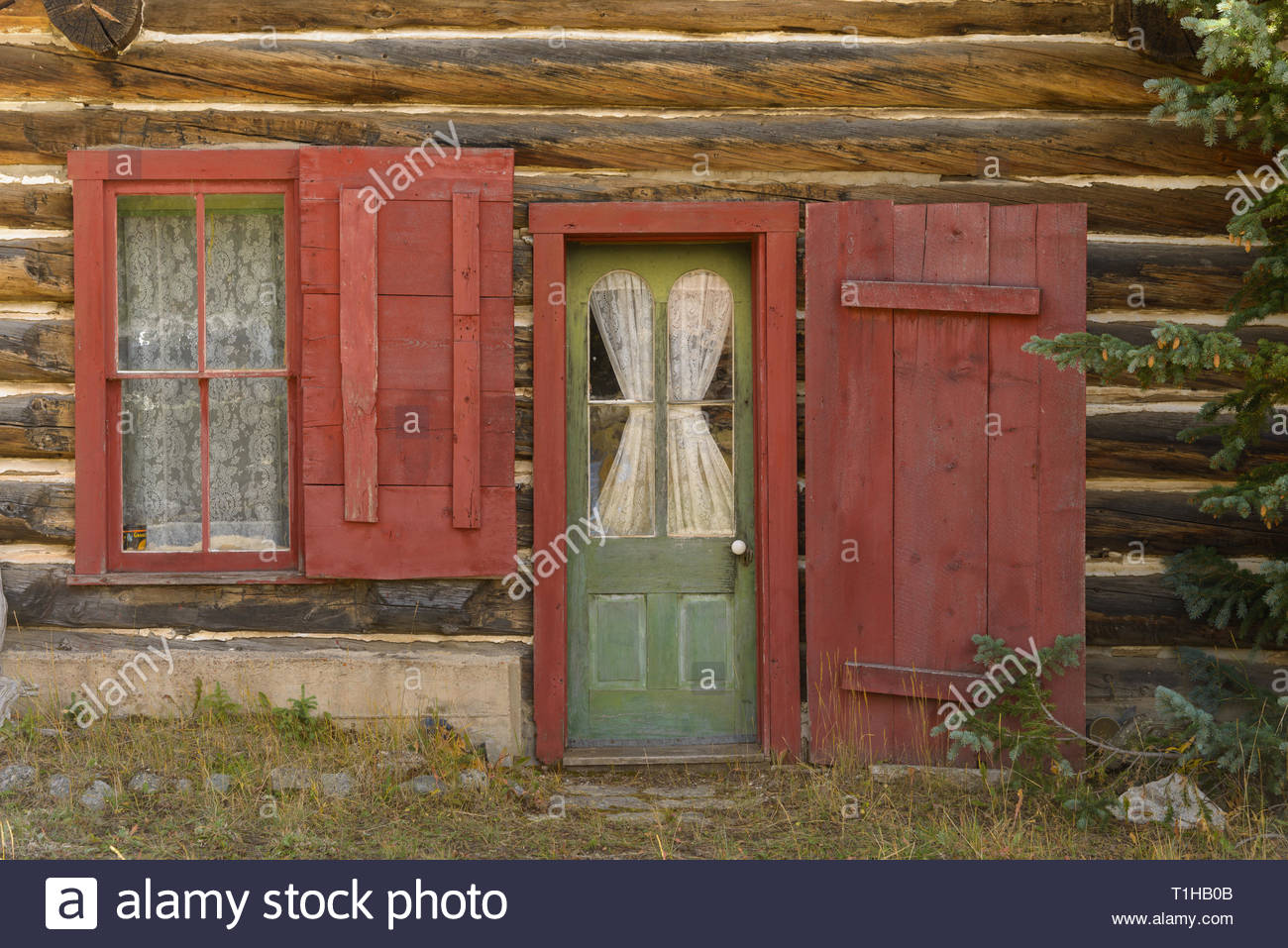 An Old Log Cabin In Tin Cup Colorado Is Decorated With Lace