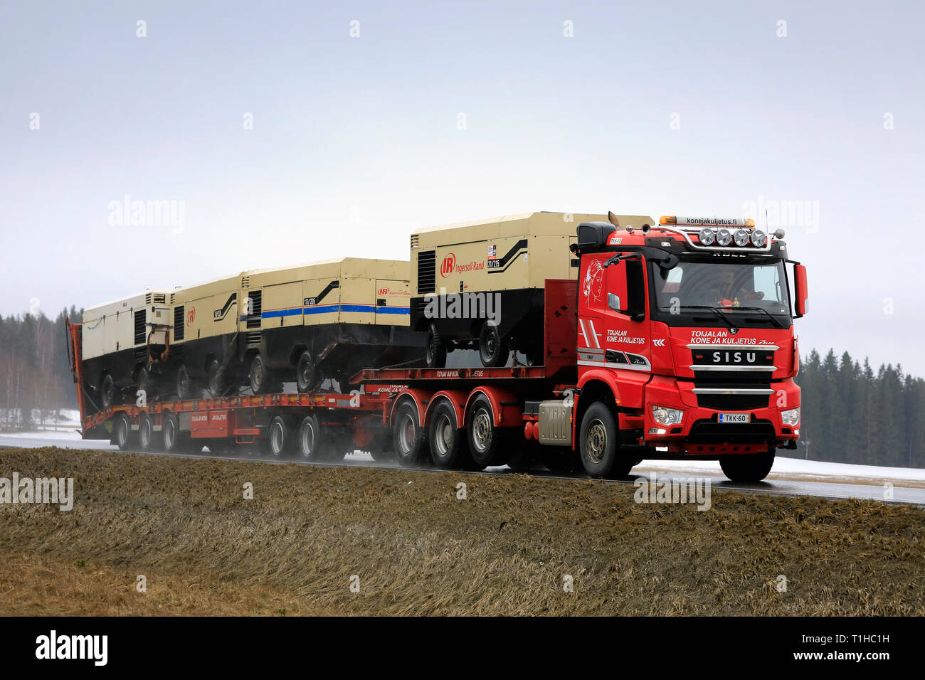 Humppila, Finland - March 23, 2019: Sisu Polar truck transports three  Ingersoll Rand air compressors on trailer along highway on a rainy day of  spring Stock Photo - Alamy