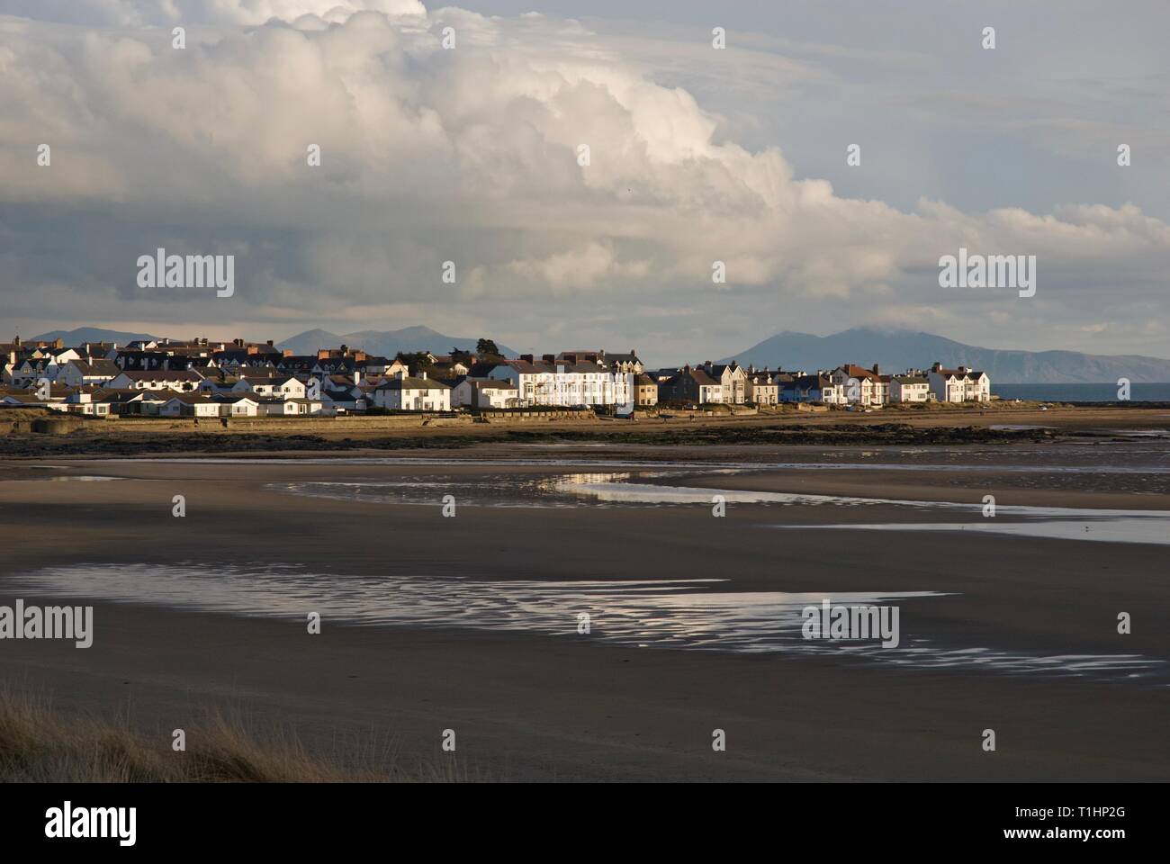 A distant view of the Village of Rhosneigr from across the dunes of Trewan Common, Rhosneigr, Anglesey, North Wales, UK Stock Photo