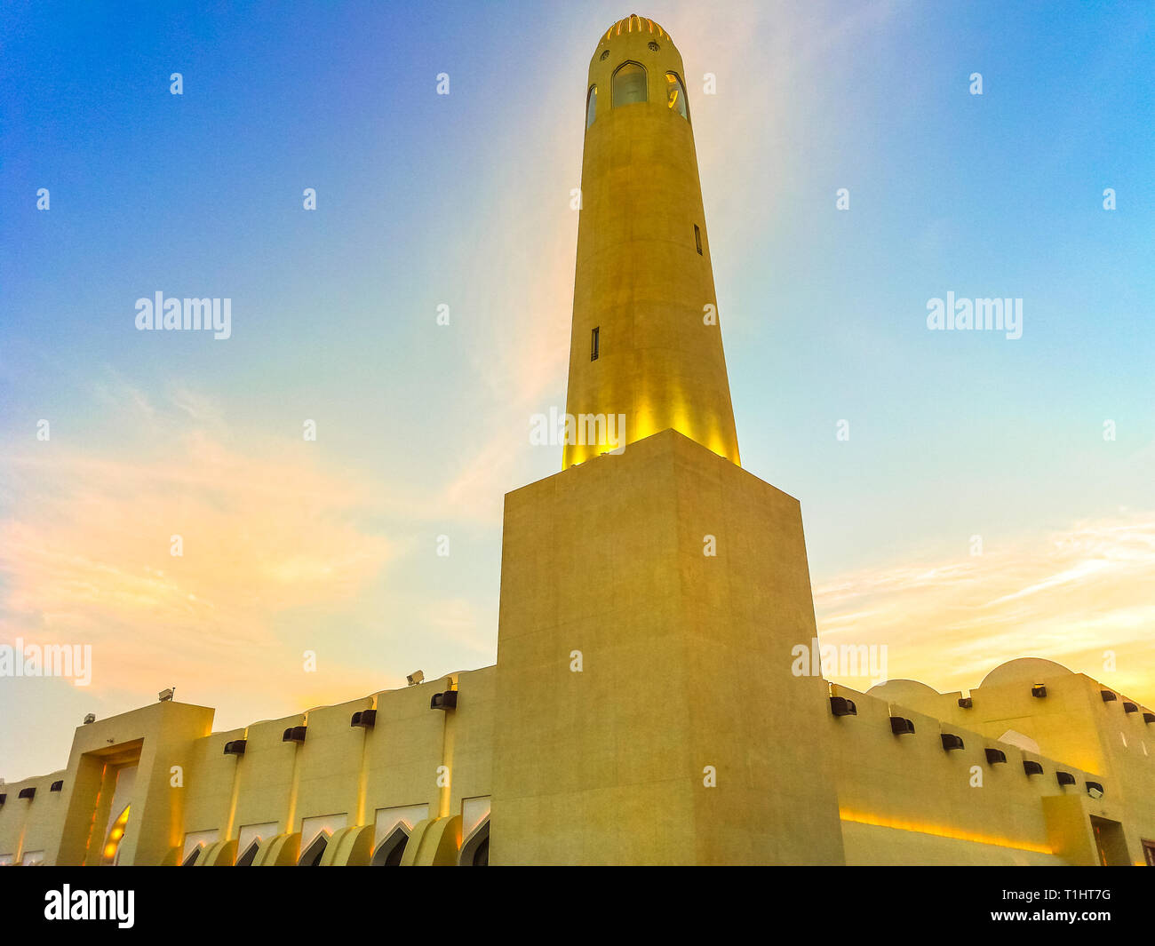 Closeup of State Grand Mosque with a minaret at sunset light. Doha mosque in Downtown, Qatar, Middle East, Arabian Peninsula, persian Gulf. Landmark Stock Photo