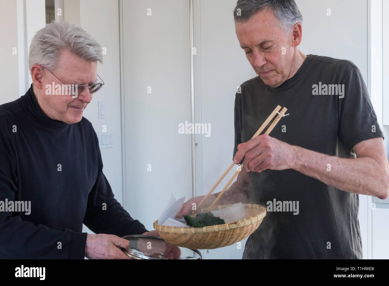 Two Mature menPreparing a Meal, USA Stock Photo