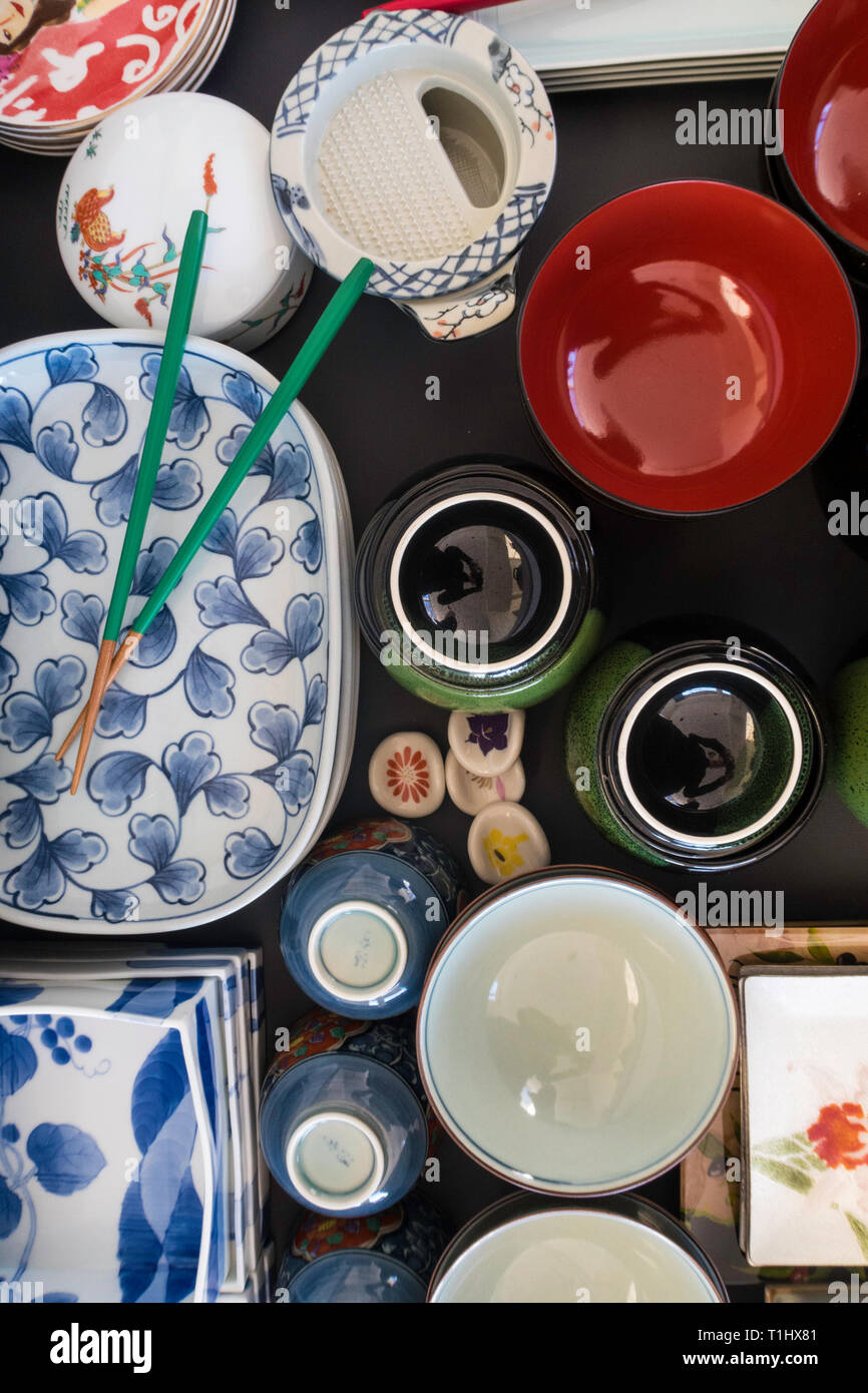 Stacked and organized Japanese plates of various shapes and sizes, USA Stock Photo