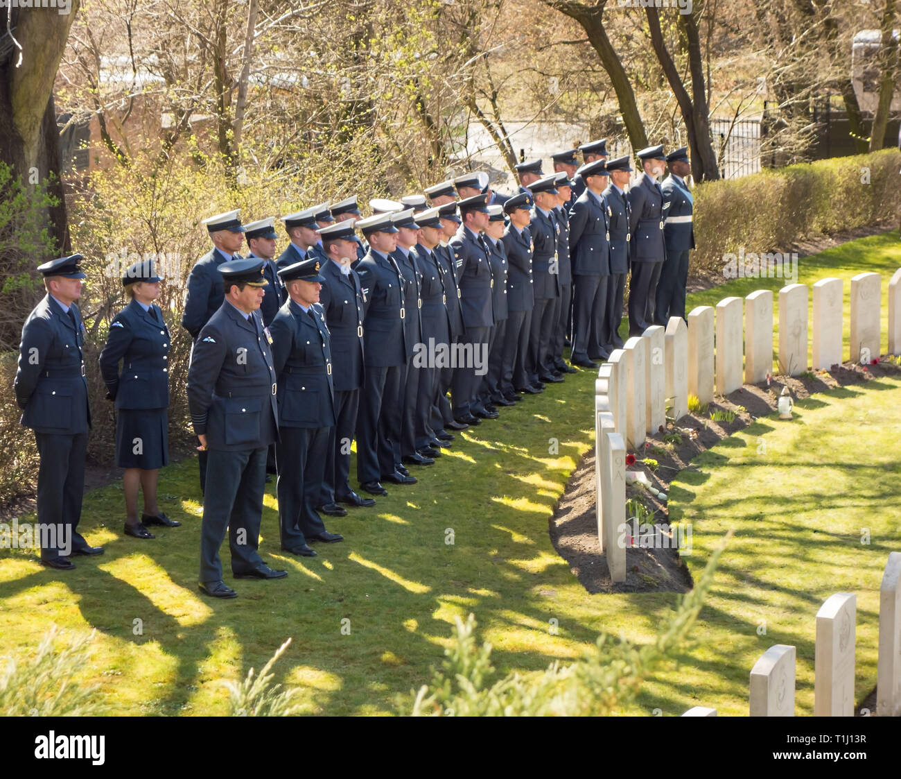 Royal air force police  pay tribute to the 50 airmen killed in the great escape from Stalag 3 on the 75th anniversary at the war cemetery at Poznan Stock Photo