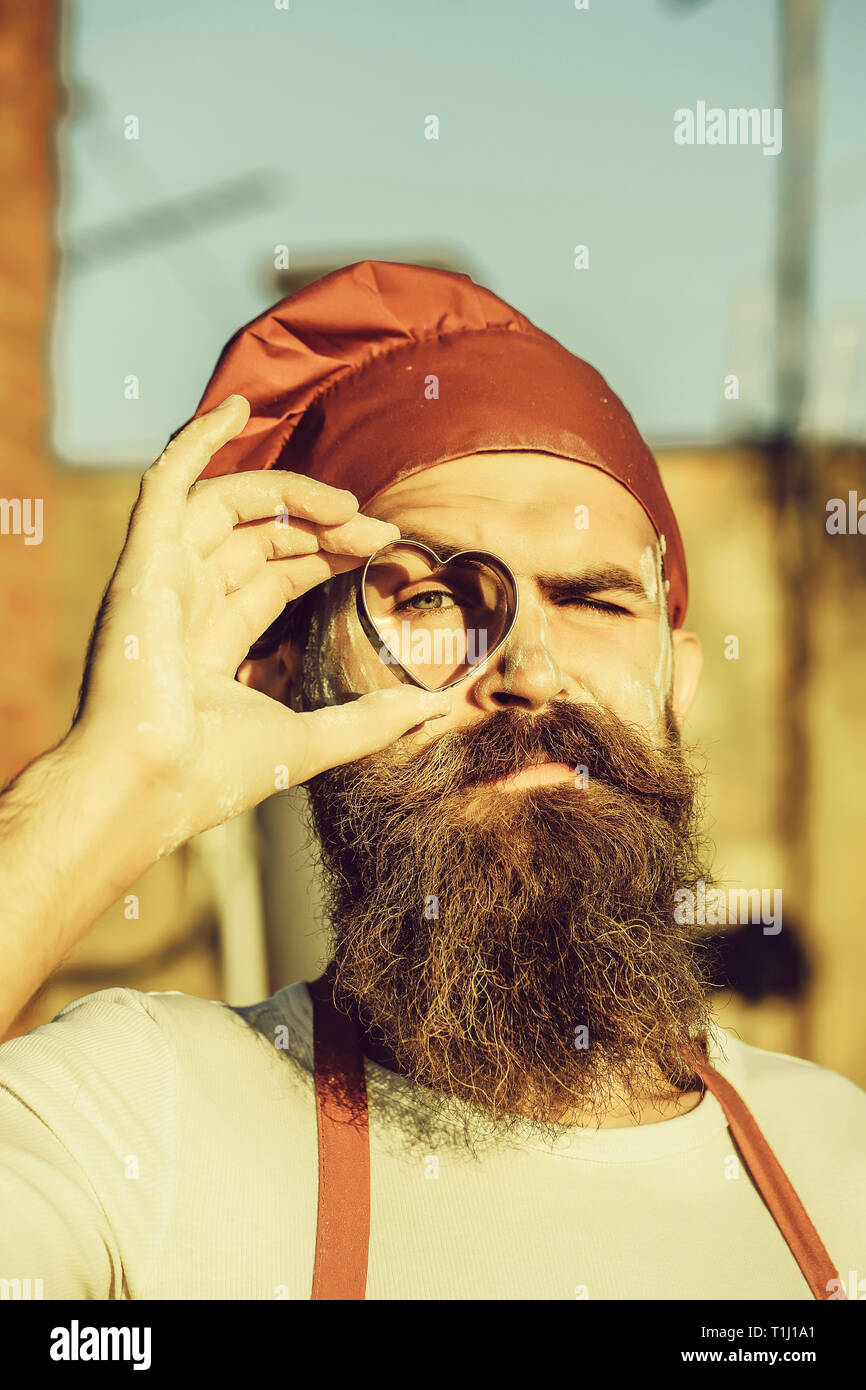 bearded cook with mould heart Stock Photo - Alamy