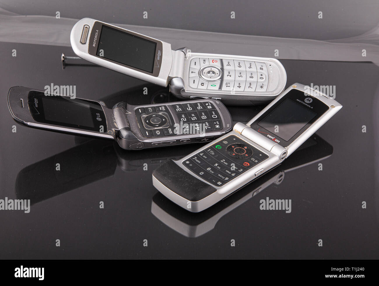 Old Classic Flip Style Cell Phones on Black Stock Photo