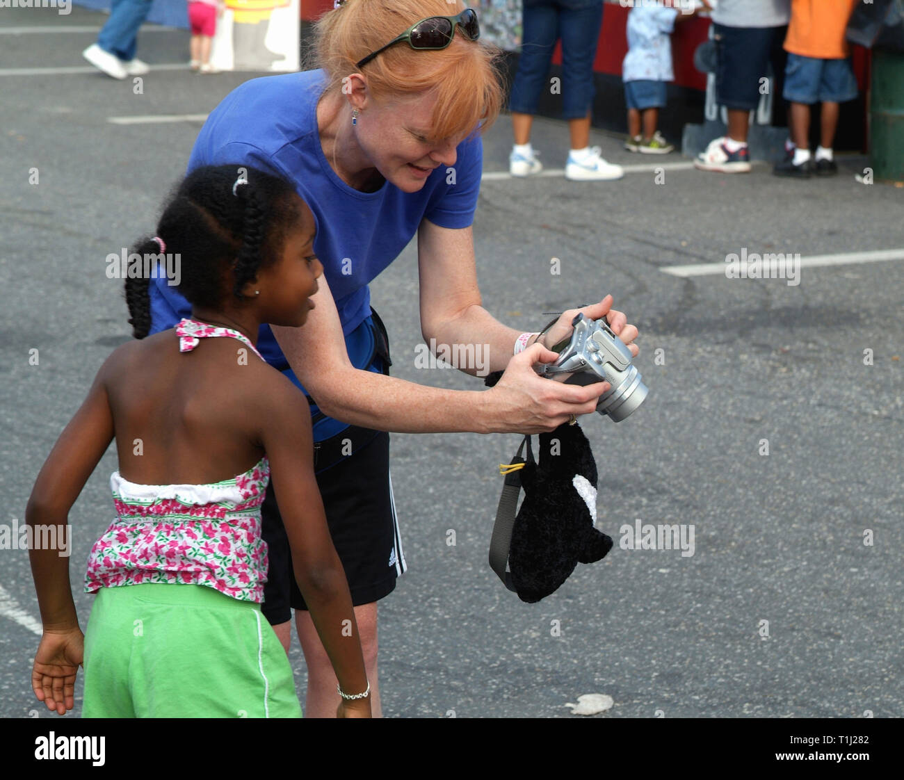 woman shows little child her pictiure on back of a digital canmera Stock Photo