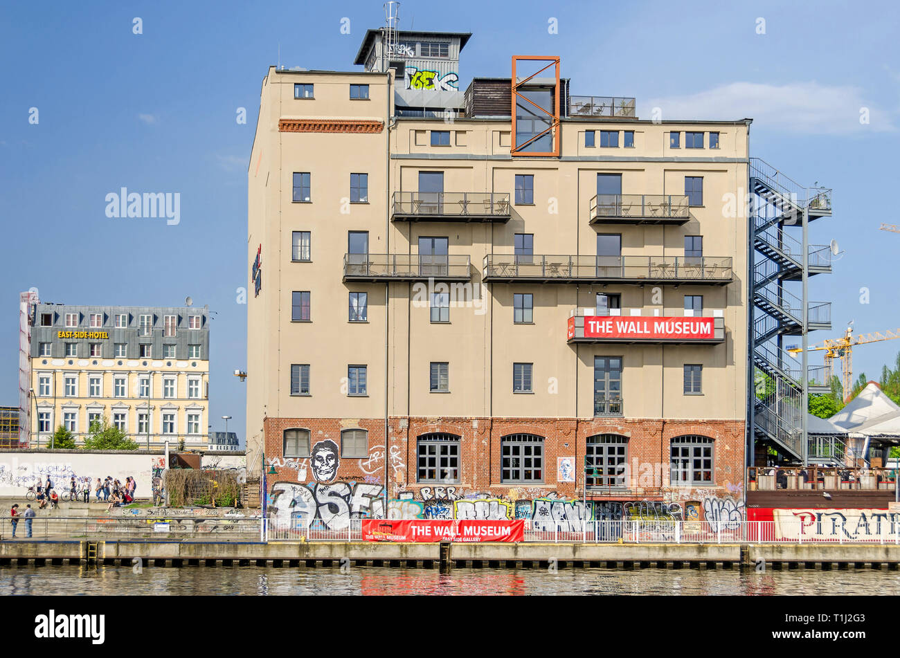 Berlin, Germany - April 22, 2018: Banks of the River Spree, building of the first and only Wall Museum and restaurant and eventlocation Pirates Stock Photo