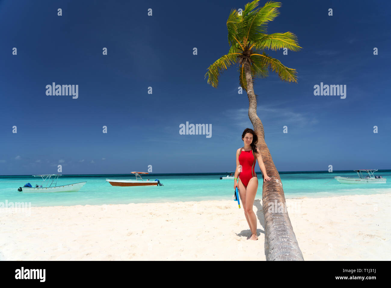 Young woman on the beautiful ocean beach in Dominican Republic Stock Photo