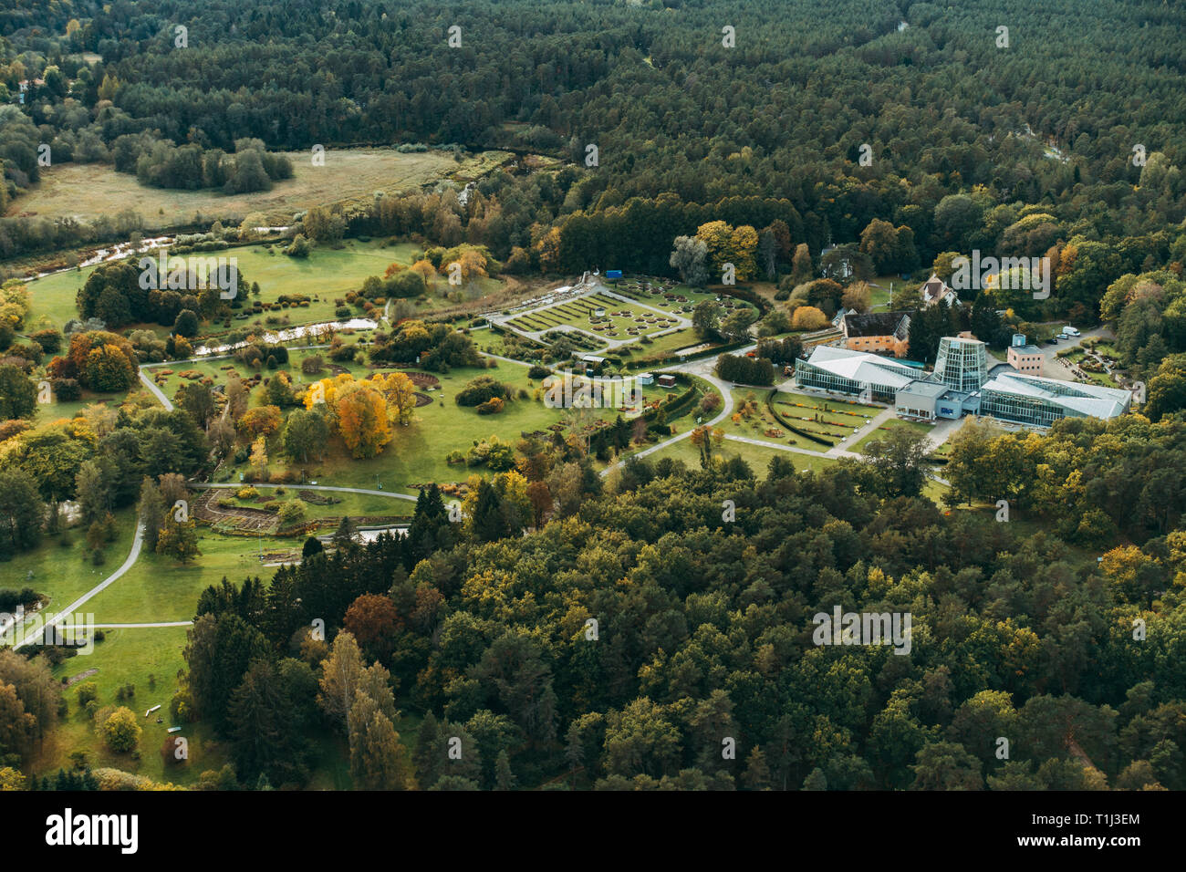 an aerial view of the Tallinn Botanic Garden, showing the lush green forest surrounds Stock Photo