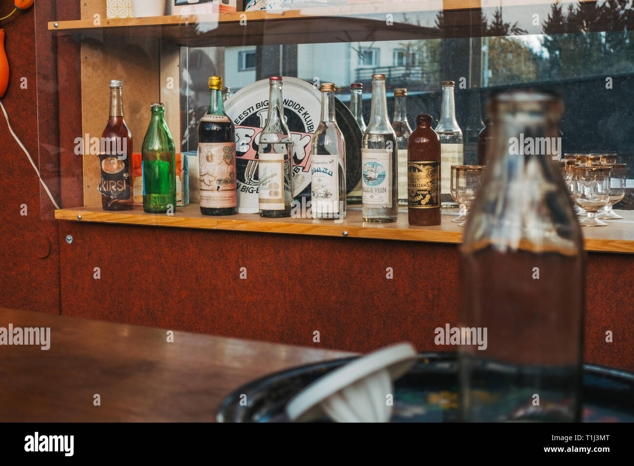 Liquor bottles sit behind a of a model Soviet bar in a museum in Tallinn, Estonia Stock Photo