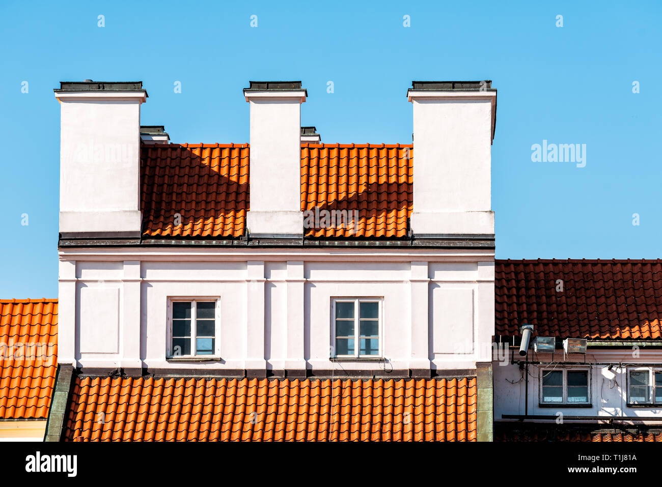 Warsaw, Poland old town market square with historic street town orange tiles architecture and
