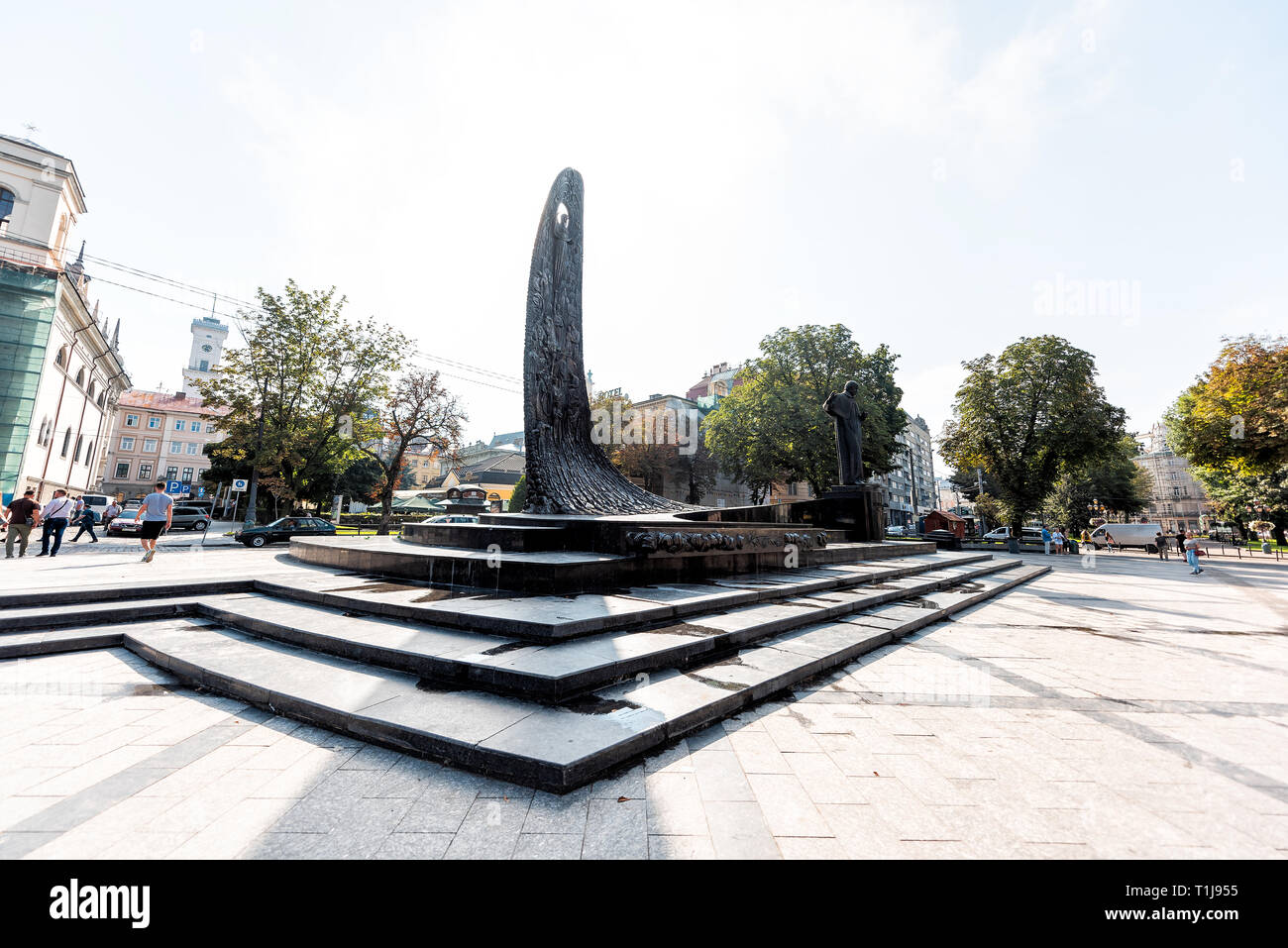 Lviv, Ukraine - August 1, 2018: People walking at Freedom or Svobody prospekt boulevard with Taras Shevchenko statue monument with stele relief of nat Stock Photo