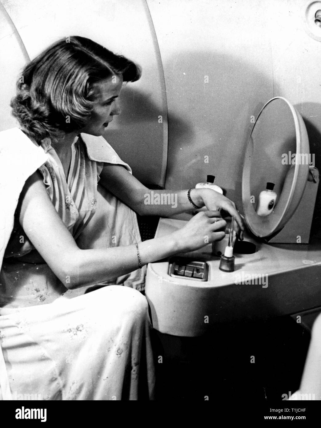 transport / transportation, aviation, passenger planes, Douglas DC-6 of the SAS Scandinavian Airline System, interior view, a woman in the charm room, later 1950s, Additional-Rights-Clearance-Info-Not-Available Stock Photo