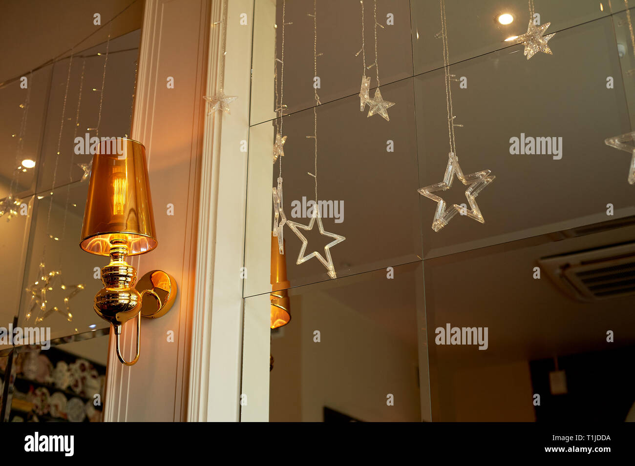 Antique wall light sconce with mirror and vintage background Stock