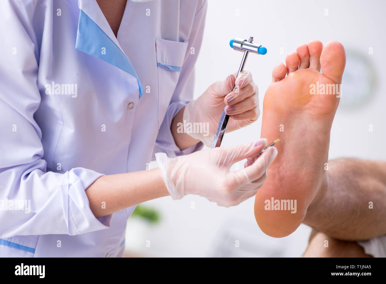 Podiatrist treating feet during procedure Stock Photo Alamy