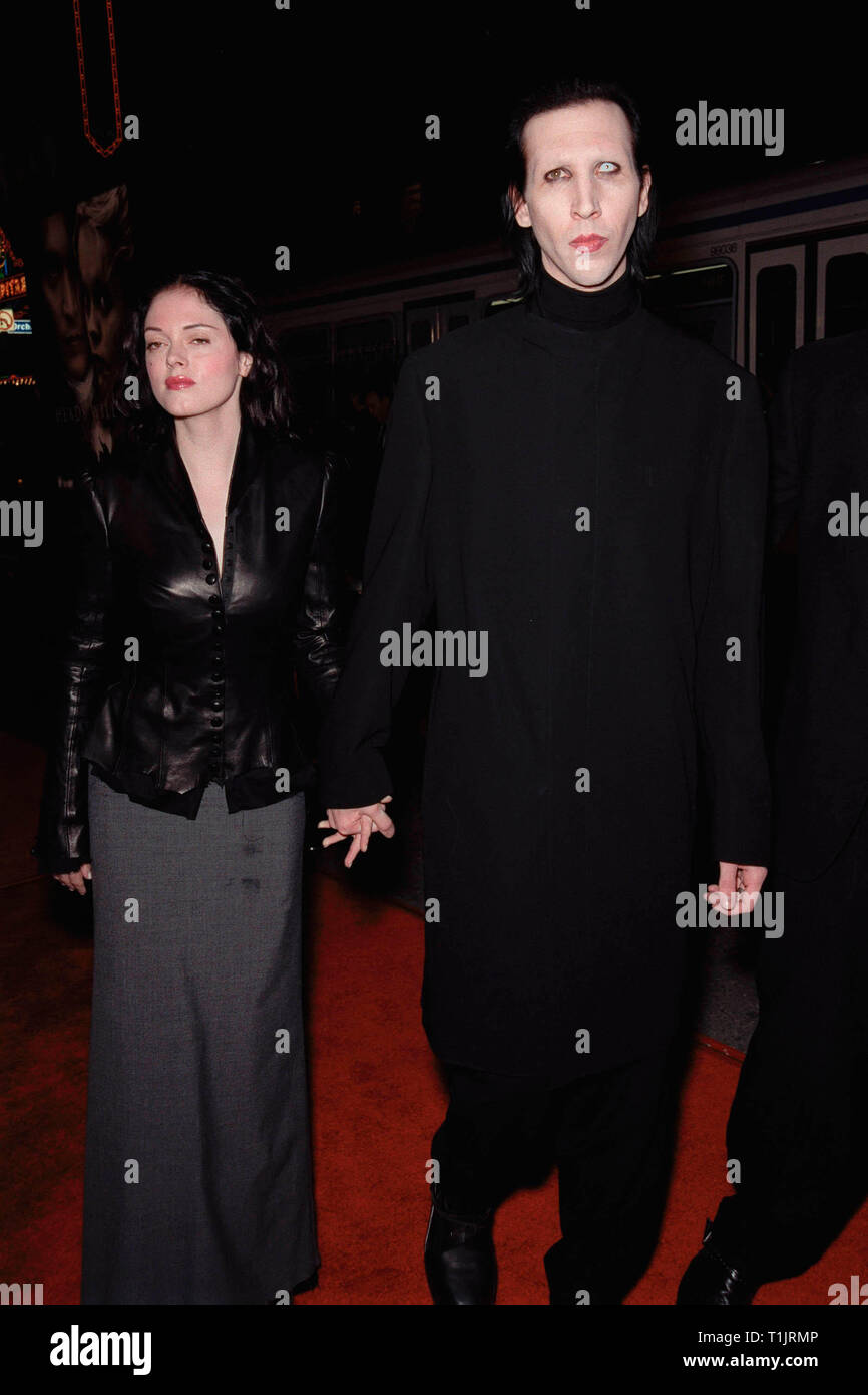 LOS ANGELES, CA. November 17, 1999:   Rock star Marilyn Manson & Actress Girlfriend Rose Mcgowan at the world premiere, in Hollywood, of  'Sleepy Hollow' which stars Johnny Depp & Christina Ricci. © Paul Smith / Featureflash Stock Photo