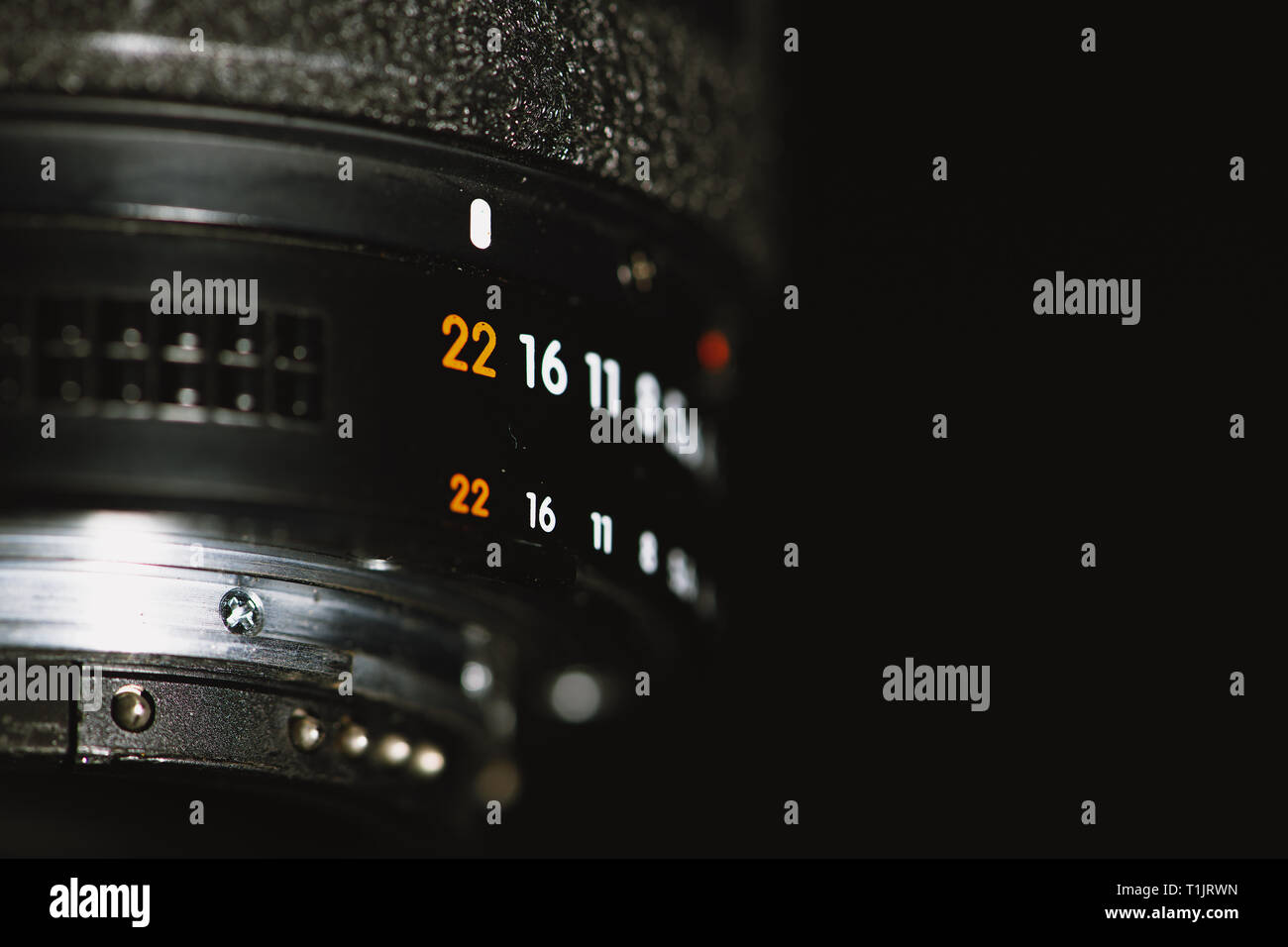 Camera lens with aperture numbers on a black background Stock Photo Alamy