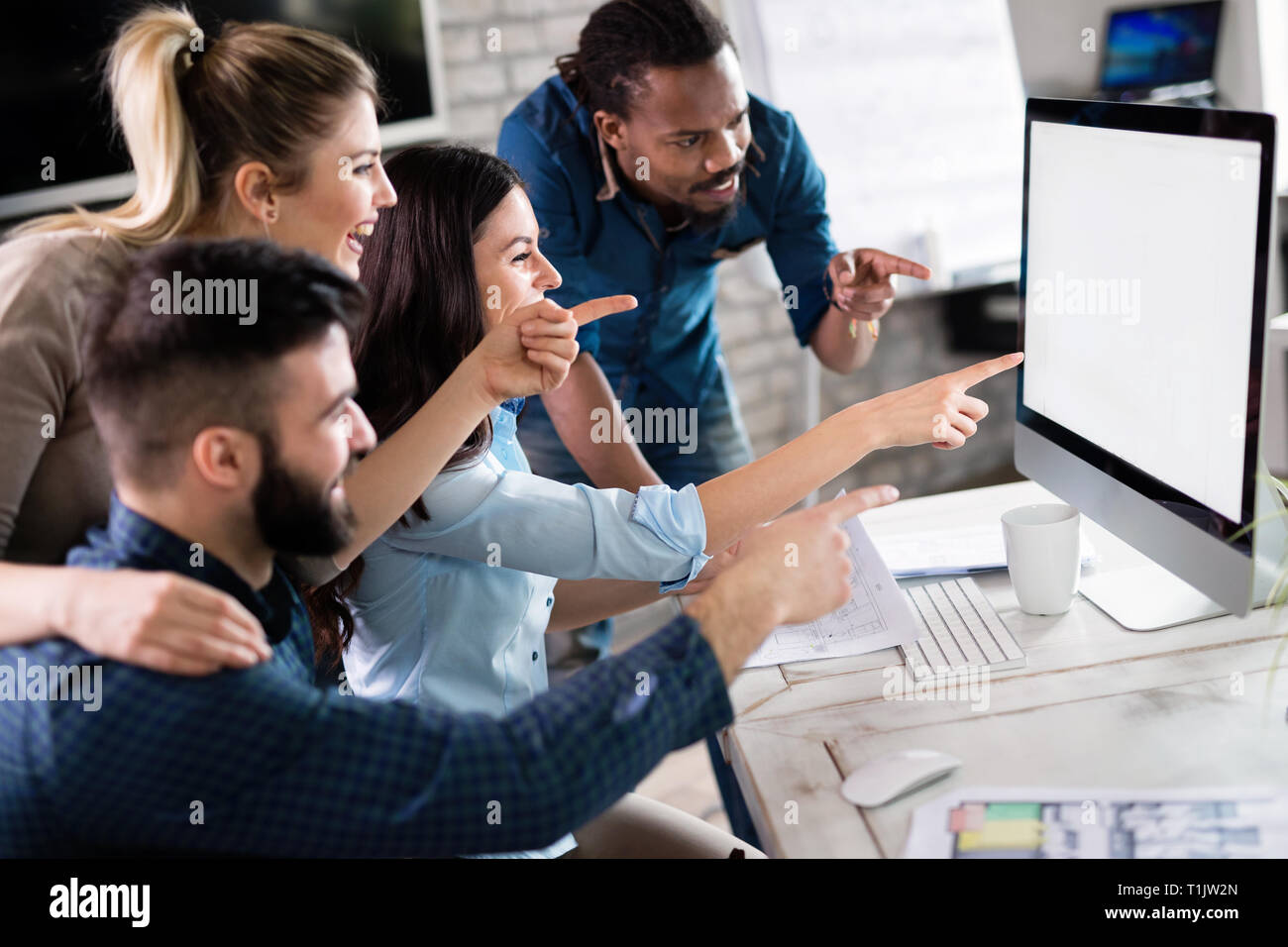 Young architects working on project in office Stock Photo