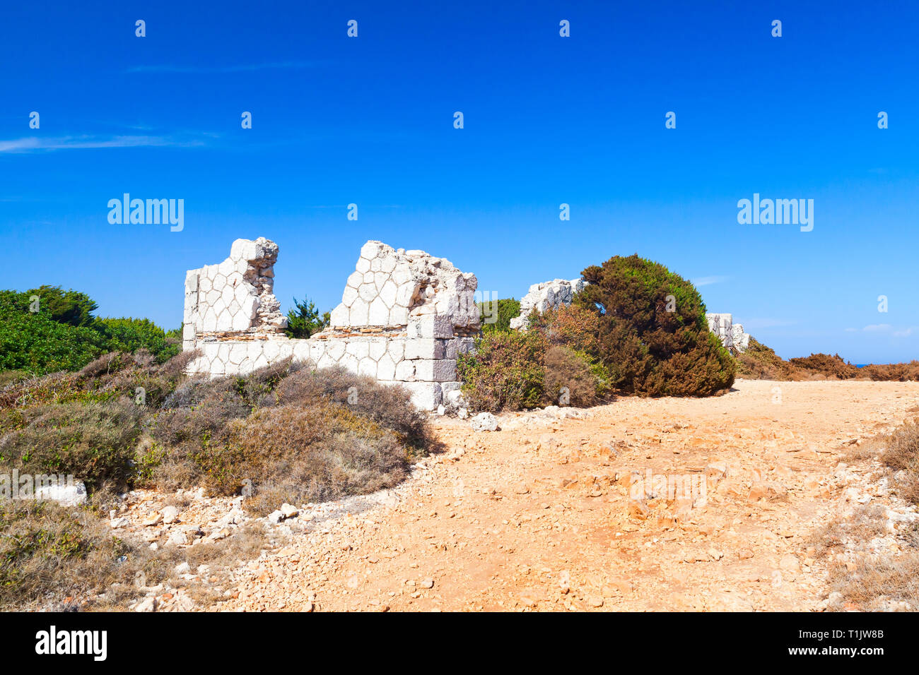 Summer rural landscape with ruins of ancient white stone house. Zakynthos, Greek island in the Ionian Sea Stock Photo
