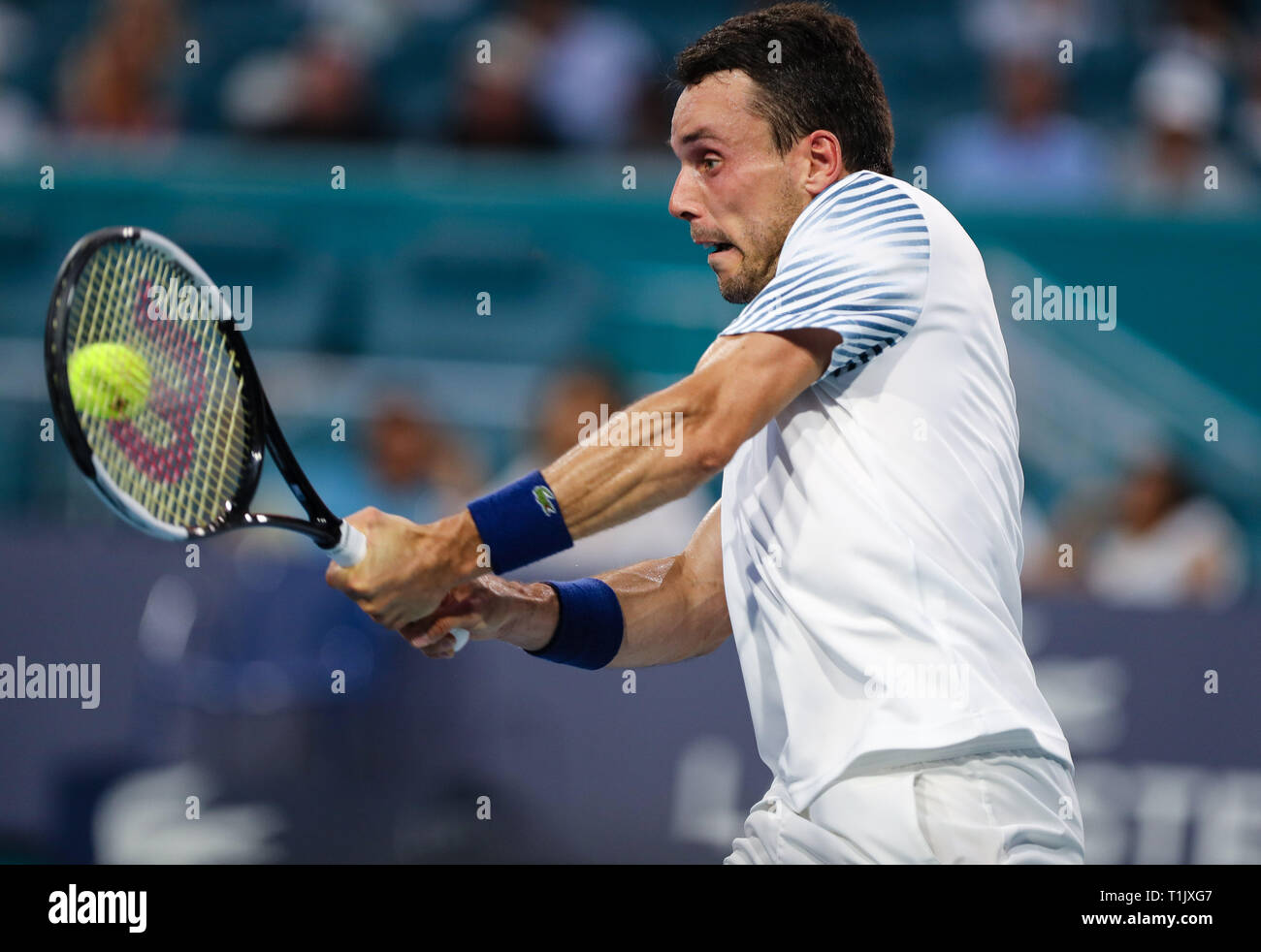 Miami Gardens, Florida, USA. 26th Mar, 2019. Roberto Bautista Agut, of Spain, in action against Novak Djokovic, of Serbia, during a fourth round match at the 2019 Miami Open Presented by Itau professional tennis tournament, played at the Hardrock Stadium in Miami Gardens, Florida, USA. Bautista Agut won 1-6, 7-5, 6-3. Mario Houben/CSM/Alamy Live News Stock Photo