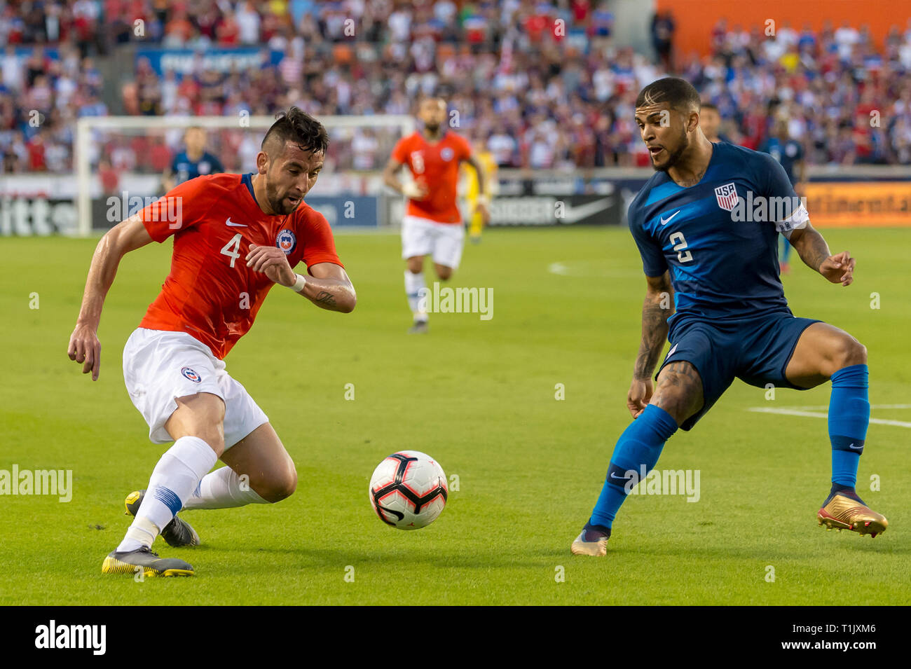 Houston, Texas, USA. 26th Mar 2019. Chile defender Mauricio Isla (4) and USA defender DeAndre Yedlin (2) during an international friendly match between USA and Chile at BBVA Compass Stadium in Houston, Texas The score at the half 1-1 © Maria Lysaker/CSM. Credit: Cal Sport Media/Alamy Live News Stock Photo