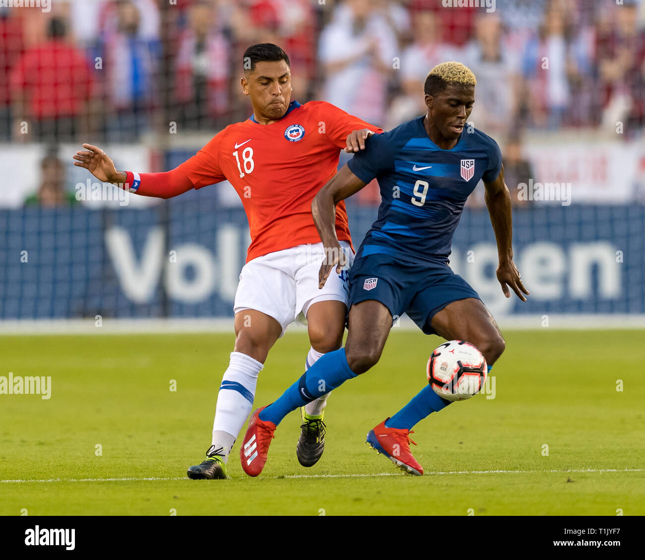 Houston, Texas, USA. 26th Mar 2019. USA forward Gyasi Zardes (9) and Chile defender Gonzalo Jara (18) battles for the ball during the second half of the international friendly match between USA and Chile at BBVA Compass Stadium in Houston, Texas The final ends in a tie 1-1 © Maria Lysaker/CSM. Credit: Cal Sport Media/Alamy Live News Stock Photo