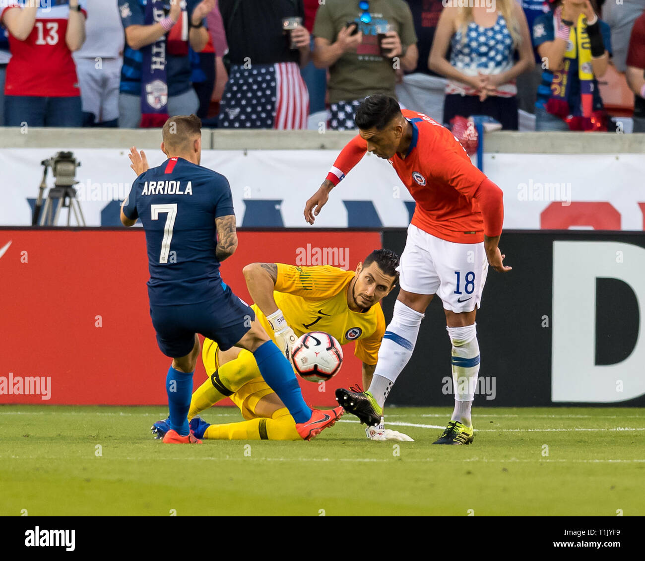 Houston, Texas, USA. 26th Mar 2019. Chile goalkeeper Brayan CortÅ½s (12) looks on as defender Gonzalo Jara (18) battles the ball from USA forward Paul Arriola (7) during the second half of the international friendly match between USA and Chile at BBVA Compass Stadium in Houston, Texas The final ends in a tie 1-1 © Maria Lysaker/CSM. Credit: Cal Sport Media/Alamy Live News Stock Photo