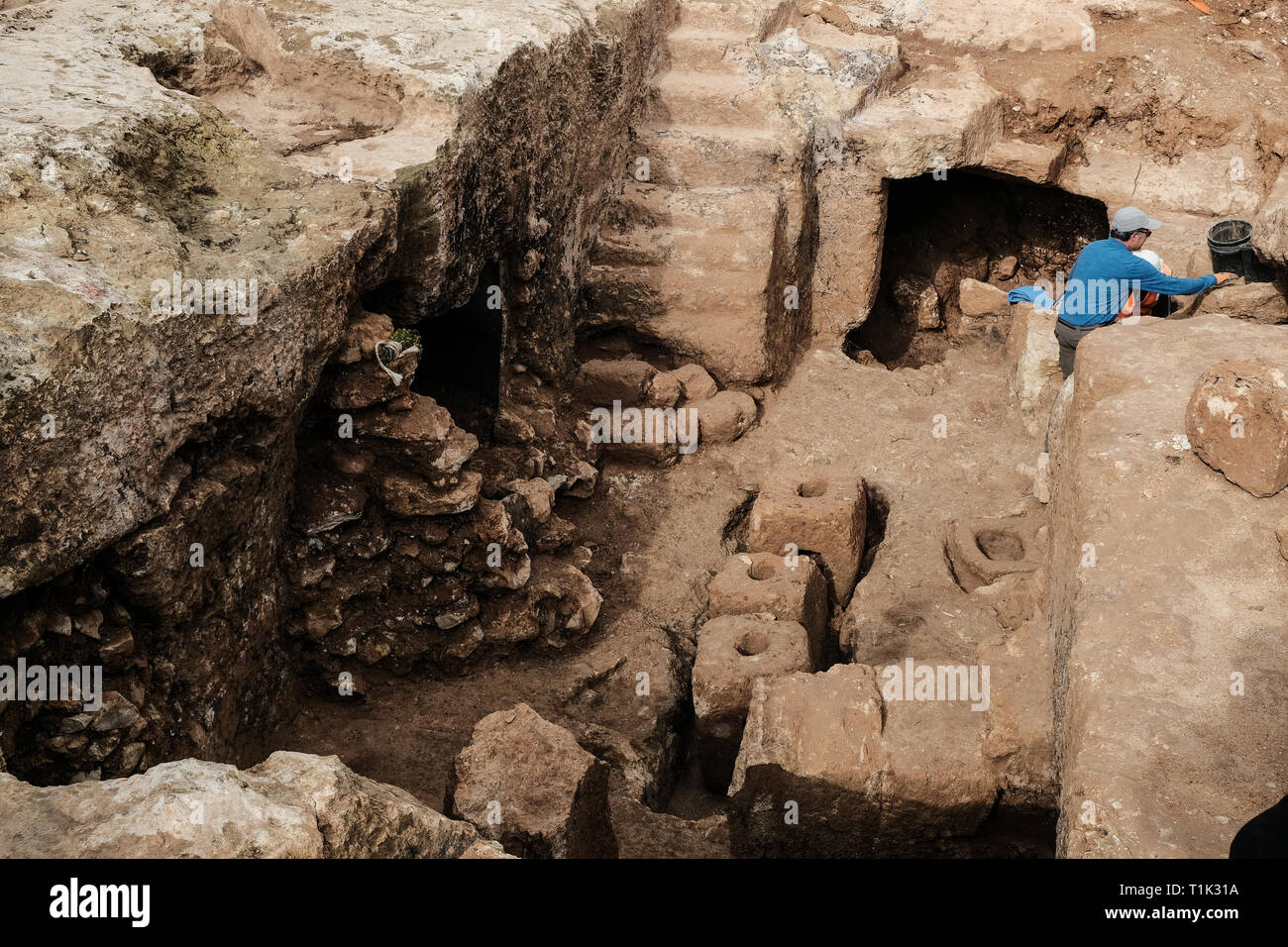 Jerusalem, Israel. 27th March, 2019. A 2000 year old Hasmonean period, 2nd temple era, Jewish village of agricultural nature, has been uncovered in excavations conducted in the Sharafat neighborhood of Jerusalem. Excavations have yielded remains of a large wine press containing fragments of many storage jars, a large columbarium cave (rock cut dovecote), an olive press, a large ritual bath (mikveh), a water cistern, rock quarries and installations. . Credit: Nir Alon/Alamy Live News Stock Photo