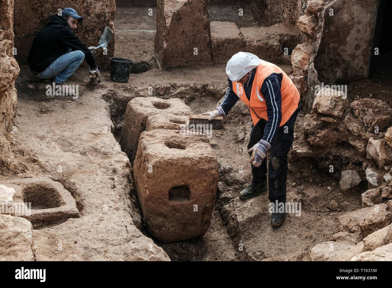 Jerusalem, Israel. 27th March, 2019. A 2000 year old Hasmonean period, 2nd temple era, Jewish village of agricultural nature, has been uncovered in excavations conducted in the Sharafat neighborhood of Jerusalem. Excavations have yielded remains of a large wine press containing fragments of many storage jars, a large columbarium cave (rock cut dovecote), an olive press, a large ritual bath (mikveh), a water cistern, rock quarries and installations. . Credit: Nir Alon/Alamy Live News Stock Photo