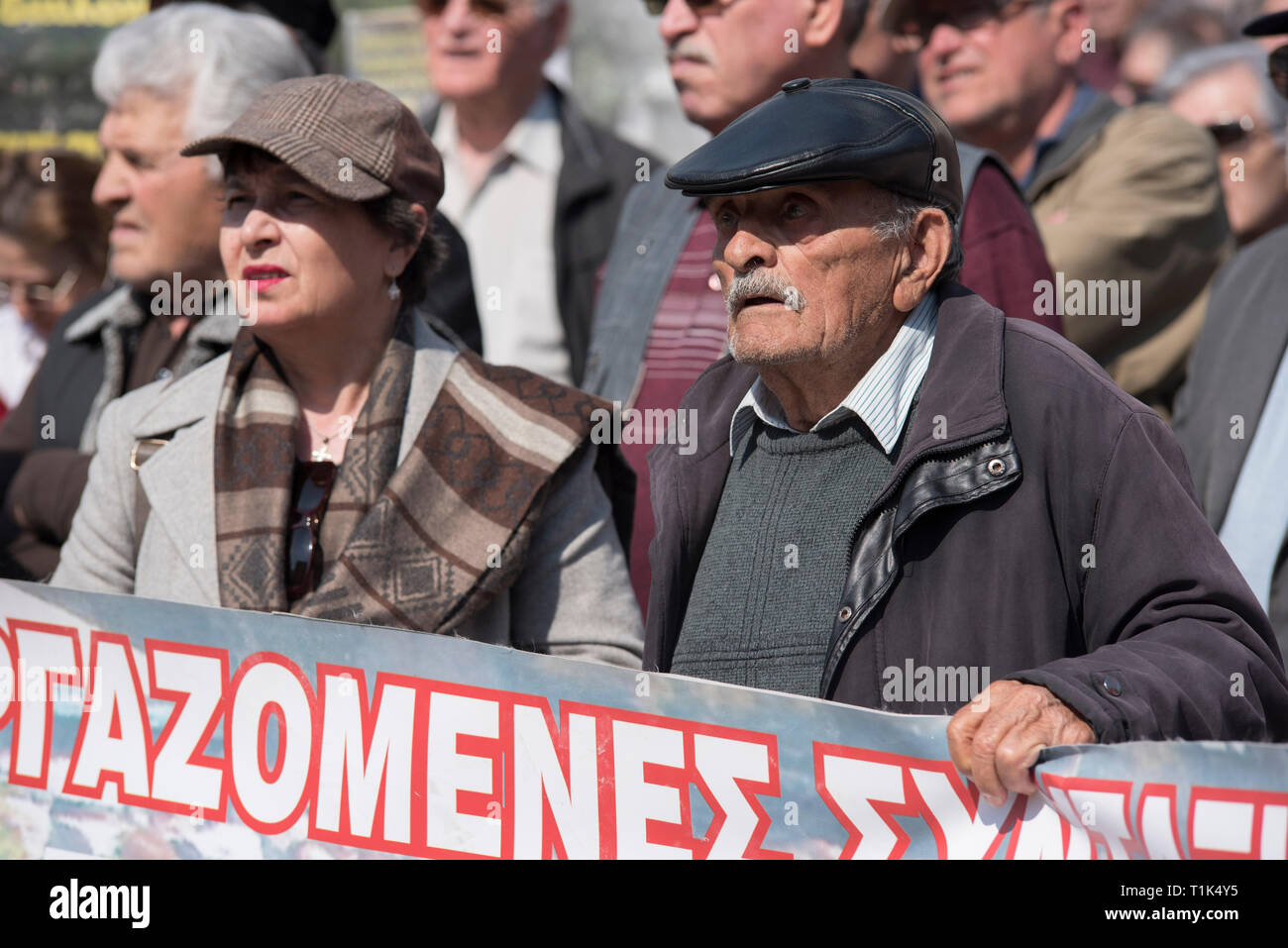 Athens, Greece. 27th Mar 2019. Pensioners march to the prime minister's office at Maximos Mansion shouting slogans against austerity and cuts in social security. Pensioners' unions took to the streets to protest over pension cuts and demand return of their slashed pensions, as their income has been shrinking since Greece entered the bailout deals in 2010. Credit: Nikolas Georgiou/Alamy Live News Stock Photo