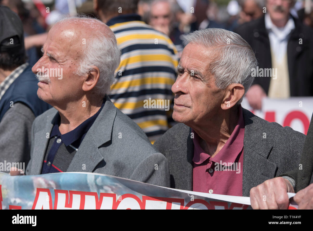 Athens, Greece. 27th Mar 2019. Protesters attend speeches by pensioners' unionists as they prepare to march to the prime minister's office at Maximos Mansion. Pensioners' unions took to the streets to protest over pension cuts and fiscal policies and demand return of their slashed pensions, as their income has been shrinking since Greece entered the bailout deals in 2010. Credit: Nikolas Georgiou/Alamy Live News Stock Photo