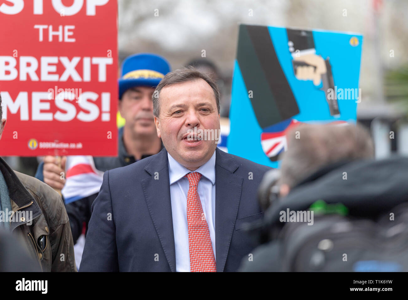 London, UK. 27th March 2019, Arron Banks, co-founder of Leave EU being pursued by Anti Brexit protesters in Westminster, London, UK. Credit: Ian Davidson/Alamy Live News Stock Photo