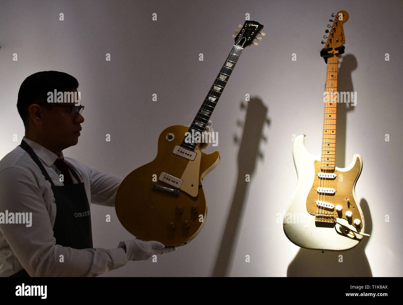 London, UK. 27th Mar, 2019. Gibson Les Paul Gold Top Kalamazoo, 1955,  estimate $30,000-50,000 and A White Fender Stratocaster with Serial Number  0001, circa 1954, estimate $100,000-150,000 at Christie's preview of the