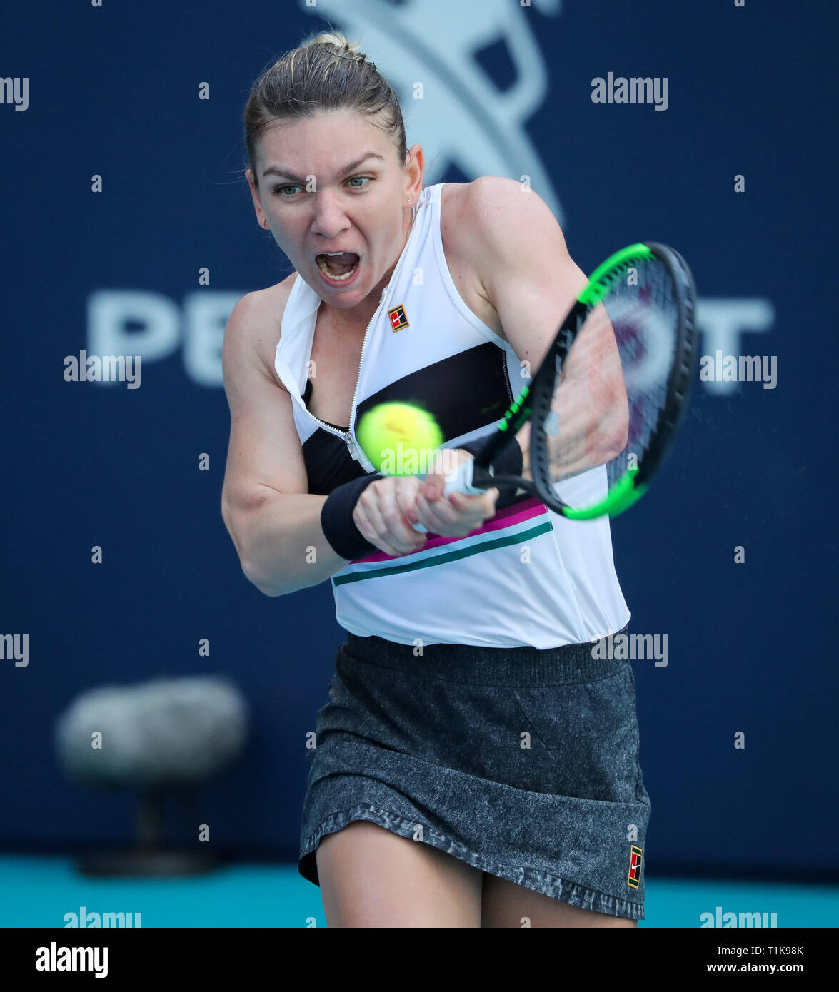 Miami Gardens, Florida, USA. 27th Mar, 2019. Simona Halep, of Romania, returns a shot to Qiang Wang, of China, during a quarter-finals match at the 2019 Miami Open Presented by Itau professional tennis tournament, played at the Hardrock Stadium in Miami Gardens, Florida, USA. Halep won 6-4, 7-5. Mario Houben/CSM/Alamy Live News Stock Photo