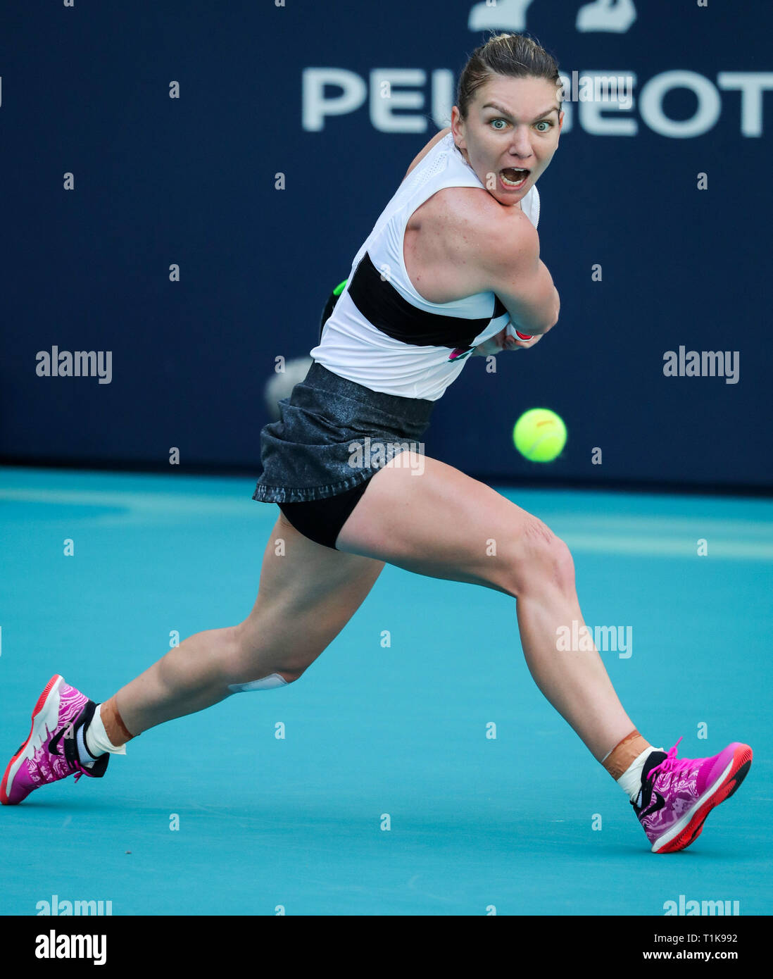 Miami Gardens, Florida, USA. 27th Mar, 2019. Simona Halep, of Romania, in action against Qiang Wang, of China, during a quarter-finals match at the 2019 Miami Open Presented by Itau professional tennis tournament, played at the Hardrock Stadium in Miami Gardens, Florida, USA. Halep won 6-4, 7-5. Mario Houben/CSM/Alamy Live News Stock Photo