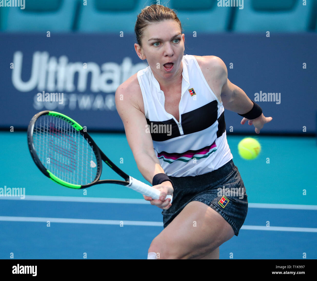 Miami Gardens, Florida, USA. 27th Mar, 2019. Simona Halep, of Romania, plays a volley against Qiang Wang, of China, during a quarter-finals match at the 2019 Miami Open Presented by Itau professional tennis tournament, played at the Hardrock Stadium in Miami Gardens, Florida, USA. Halep won 6-4, 7-5. Mario Houben/CSM/Alamy Live News Stock Photo