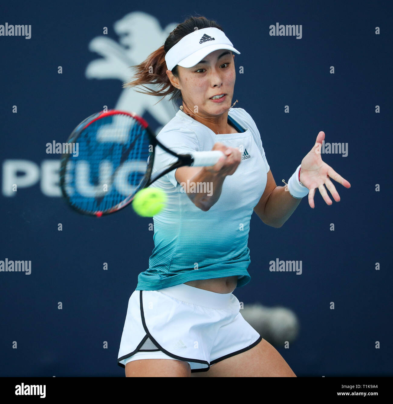 Miami Gardens, Florida, USA. 27th Mar, 2019. Qiang Wang, of China, returns a shot to Simona Halep, of Romania, during a quarter-finals match at the 2019 Miami Open Presented by Itau professional tennis tournament, played at the Hardrock Stadium in Miami Gardens, Florida, USA. Mario Houben/CSM/Alamy Live News Stock Photo