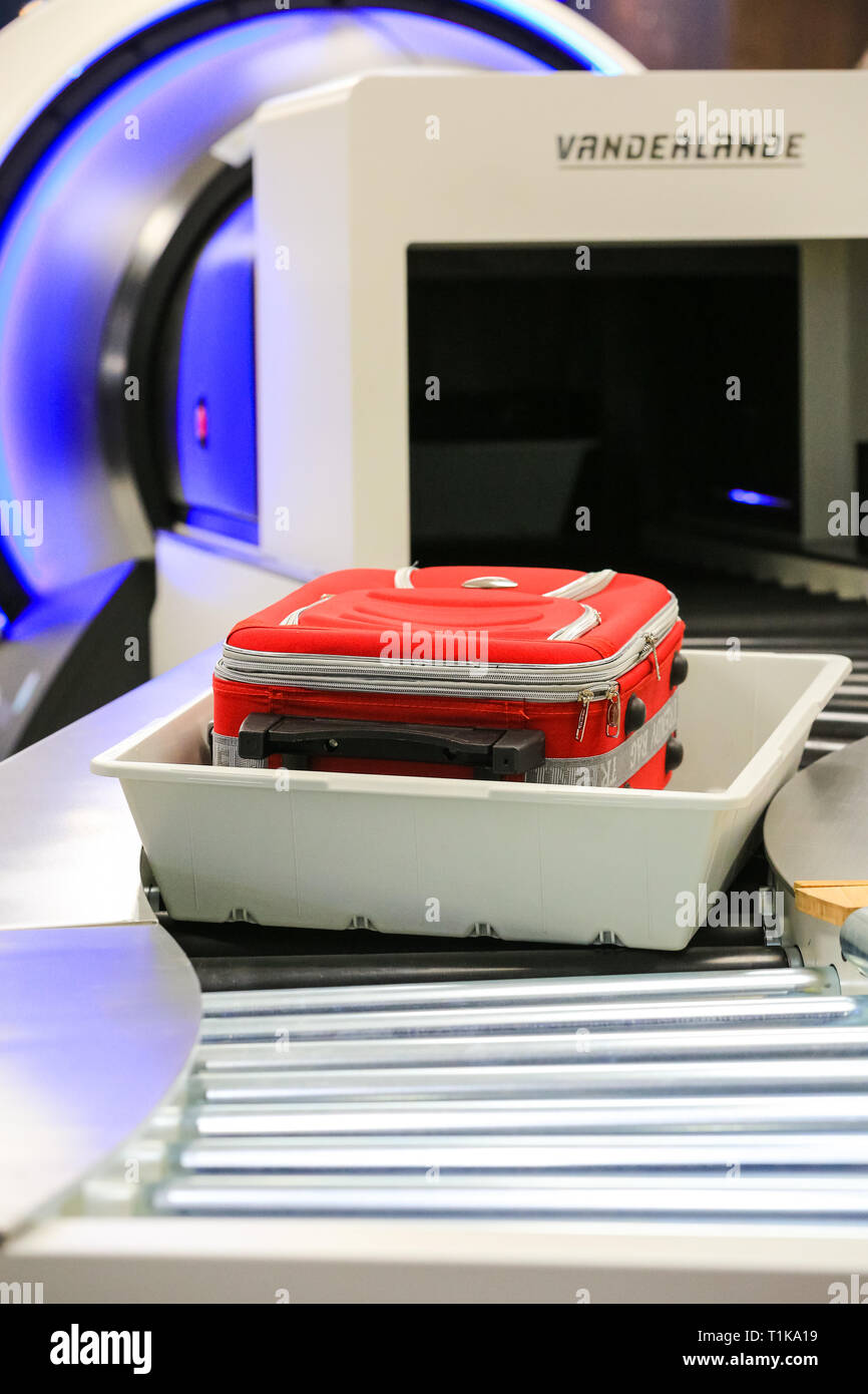 ExCel, London, UK. 27th Mar, 2019. Luggage going through a Vanderlande scanning system. The Passenger Terminal Expo 2019 brings together exhibitors and trade visitors to see the latest new technologies and product launches from more than 350 of the airport world's leading solution providers. Credit: Imageplotter/Alamy Live News Stock Photo