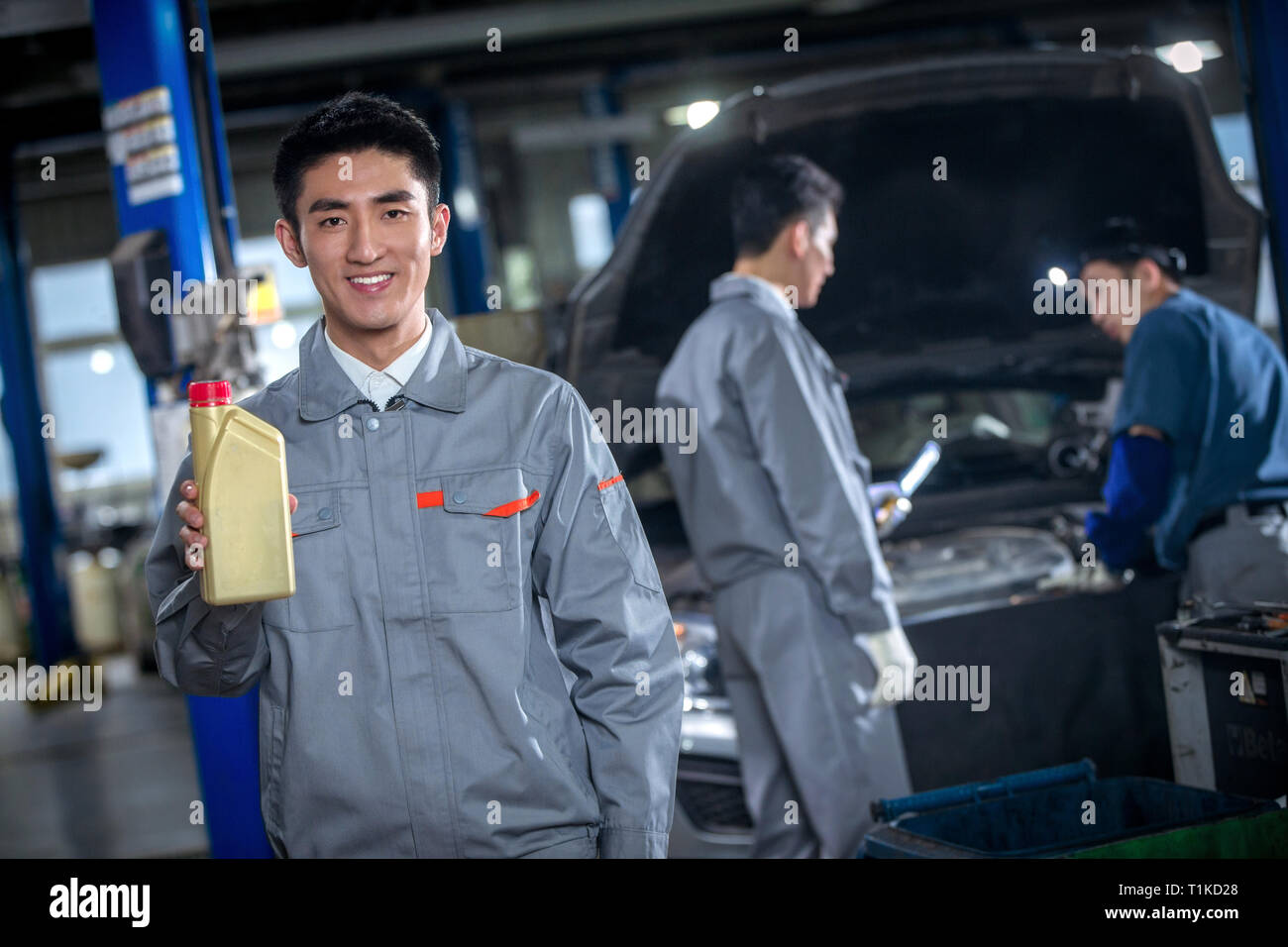 Professional Auto Service Professional repair worker showing hi-res stock photography and images ...