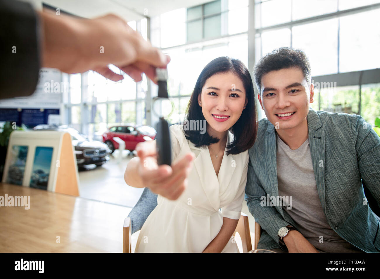 Car sales staff and customers Stock Photo - Alamy